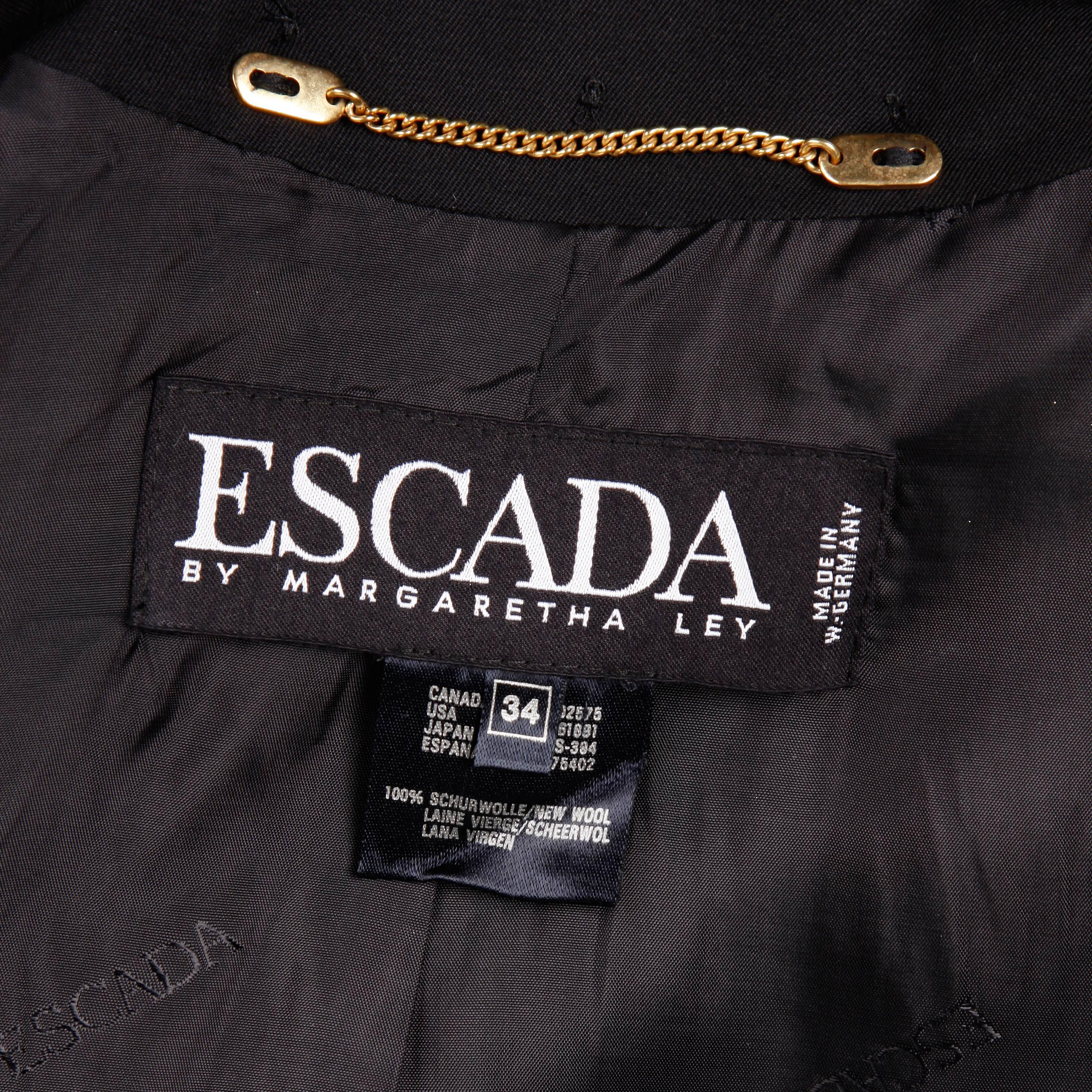 Amazing vintage black wool jacket with big gold studs by Escada. Fully lined with no closure (hangs open). 100% Wool. Marked size is an EU 34 and the jacket fits like a modern size small. The bust measures 35
