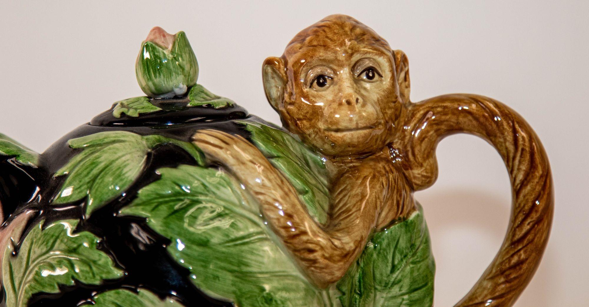 Vintage Fitz and Floyd Rain Forest Monkey Majolica ceramic Teapot.
Vintage Majolica Monkey Fitz and Floyd 1980s Rain Forest Teapot.
Designed as a whimsical monkey ceramic teapot in the jungle with palm leaves, pink flowers, the handled formed by the