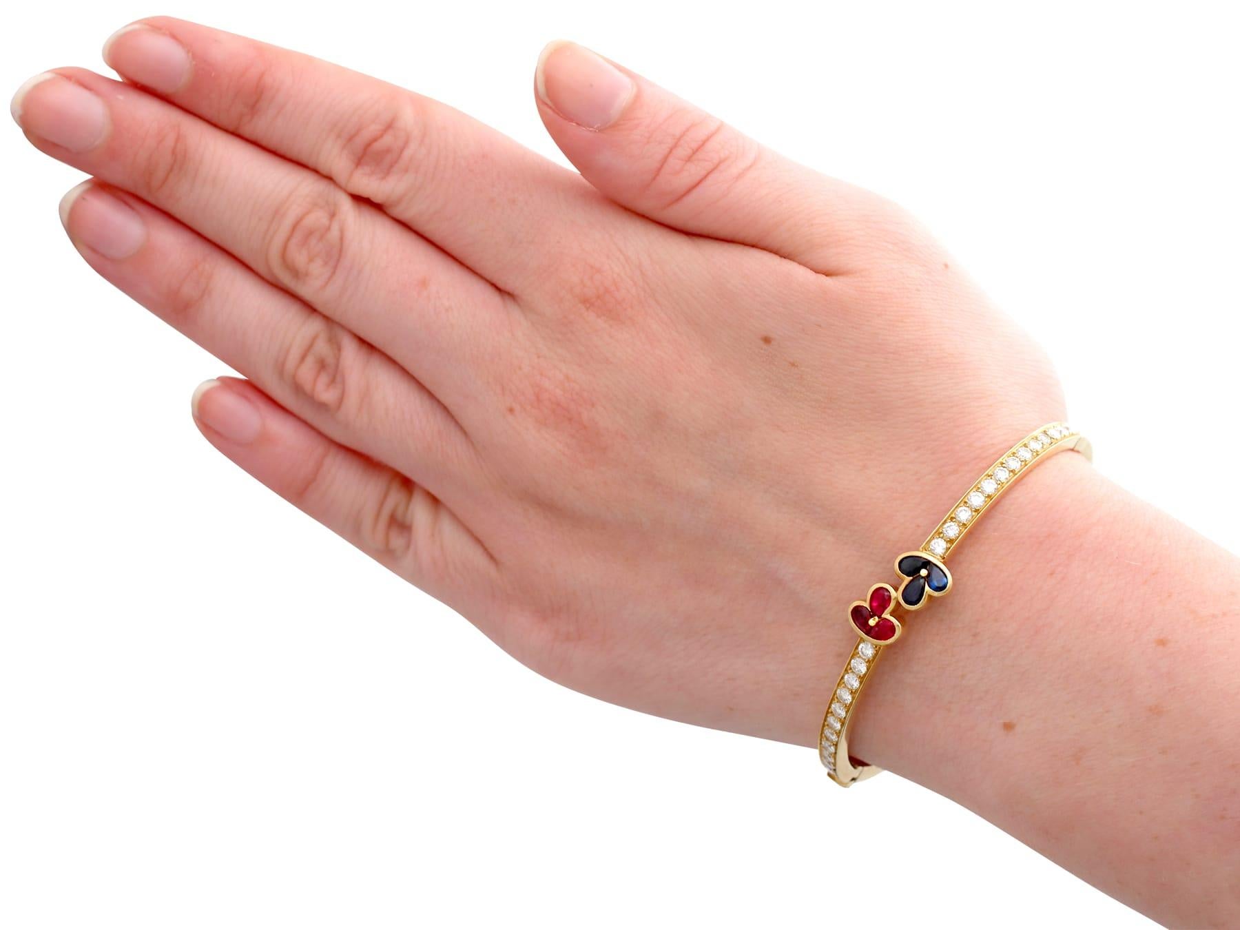 1980s Vintage French 1.05 Carat Ruby 2.16 Carat Diamond and Sapphire Gold Bangle For Sale 4