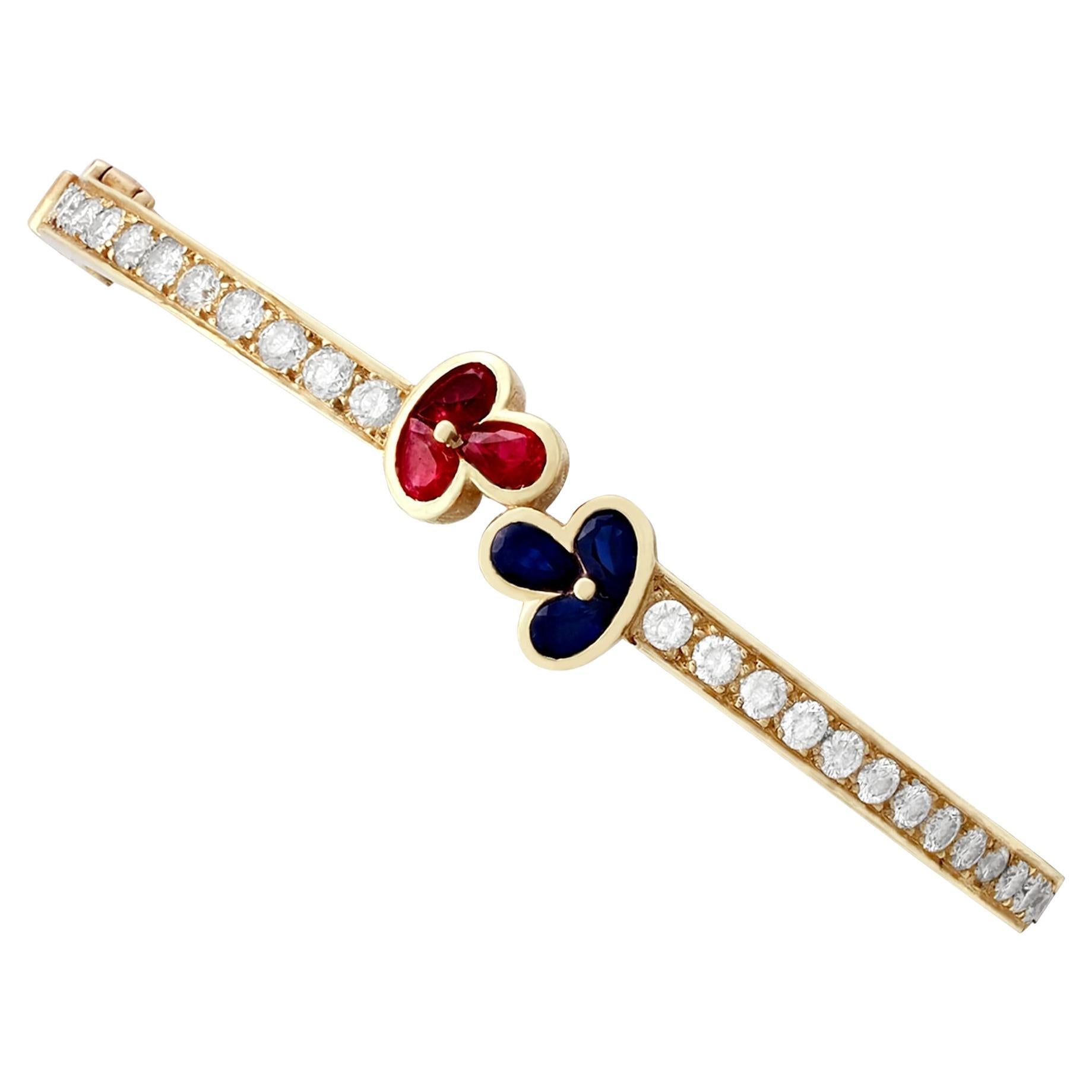 1980s Vintage French 1.05 Carat Ruby 2.16 Carat Diamond and Sapphire Gold Bangle For Sale
