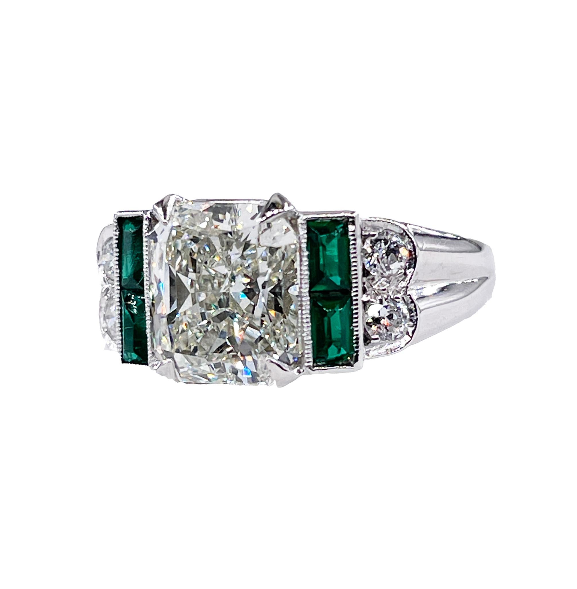 Art Deco Style Vintage GIA 3.77ctw Radiant cut Diamond & Green EMERALDs Platinum Ring, Circa 1980s

Inspired by Art Deco jewelry, colorful, bold and elaborate Diamond Ring from 1980s. The 'Era of Excess', when bold and daring fashion, colorful