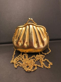 Pochette vintage anni '80 GUCCI con microcatena monogramma in tonalità oro