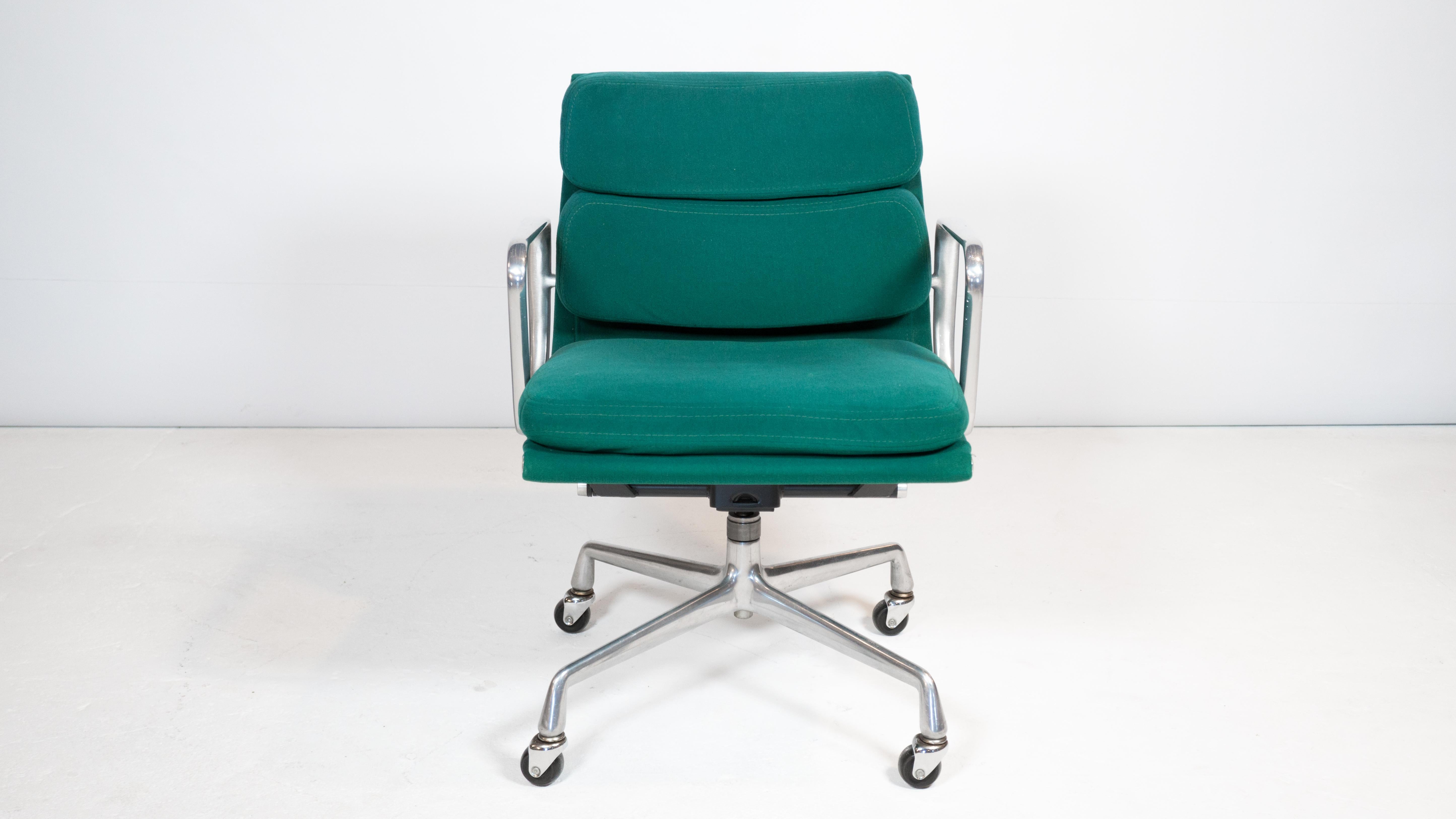 Eames Soft Pad Management chair by Charles and Ray Eames for Herman Miller circa 1983. Wrapped in the beautiful original soft turquoise fabric with plush padded seat and back cushions. Supported by a polished aluminum five-star caster base.