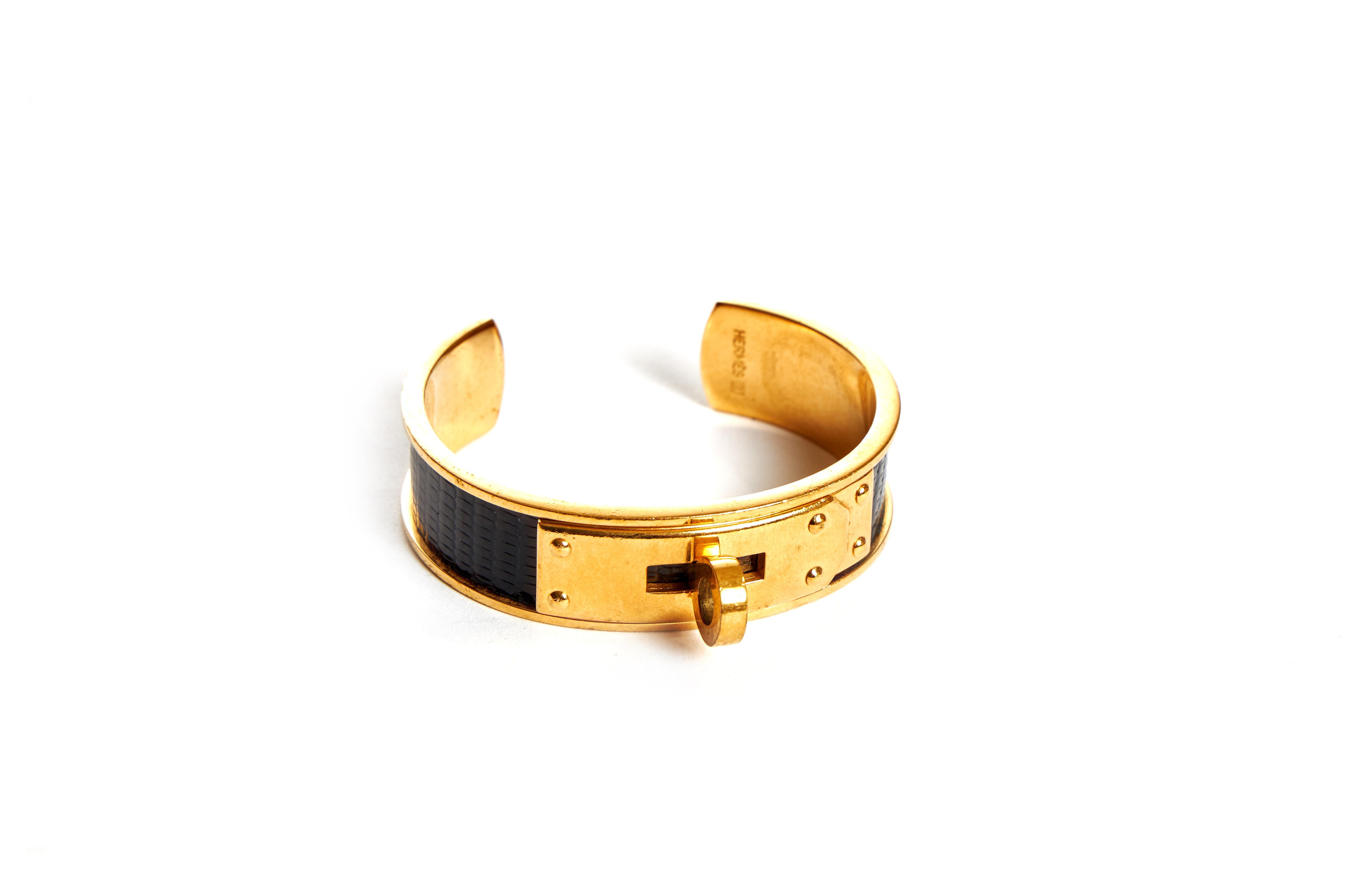 Hermès black lizard cuff with gold tone hardware. Fits a small wrist; interior, 5