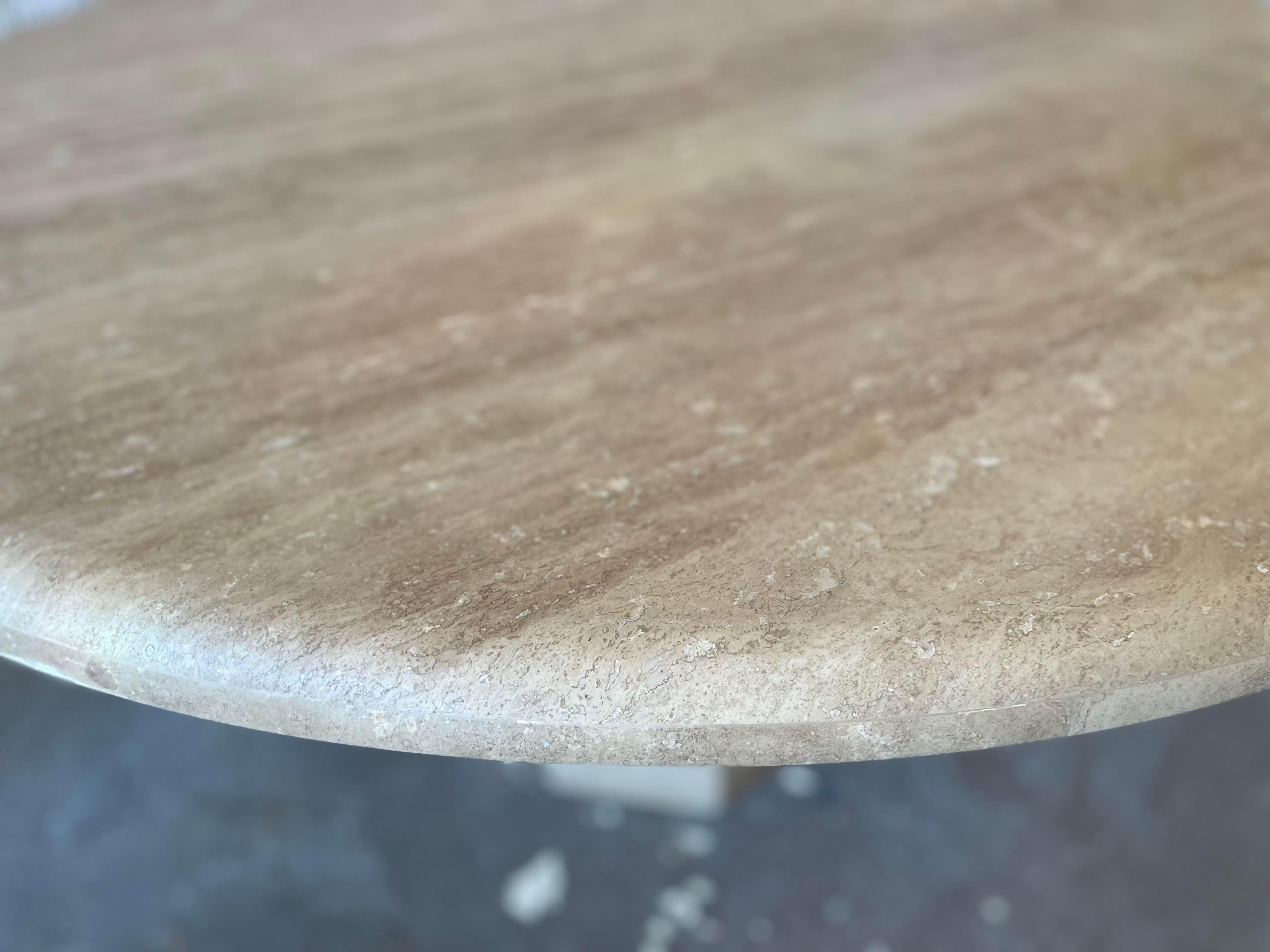 Oh I love having the old lacquer removed to reveal a beautiful matte honed texture. This technique modernizes vintage tables and makes them look brand new. This table is walnut travertine (more brown than typical ivory travertine).

The table seats