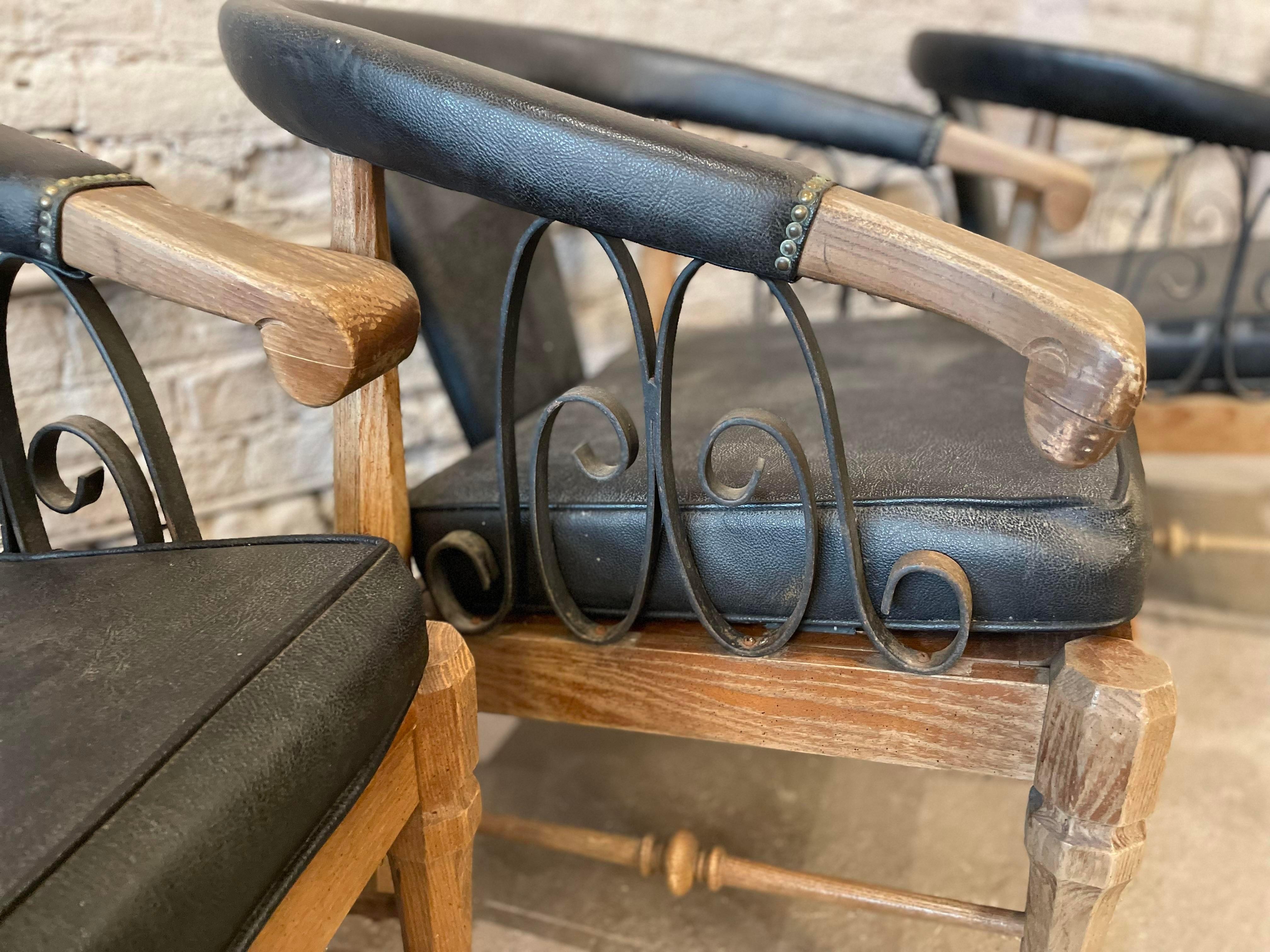 Super cool and comfortable chairs. The leather is worn (see pictures) but no tears. Can be used as is or refinished to your liking. Love the iron detailed sides. 
