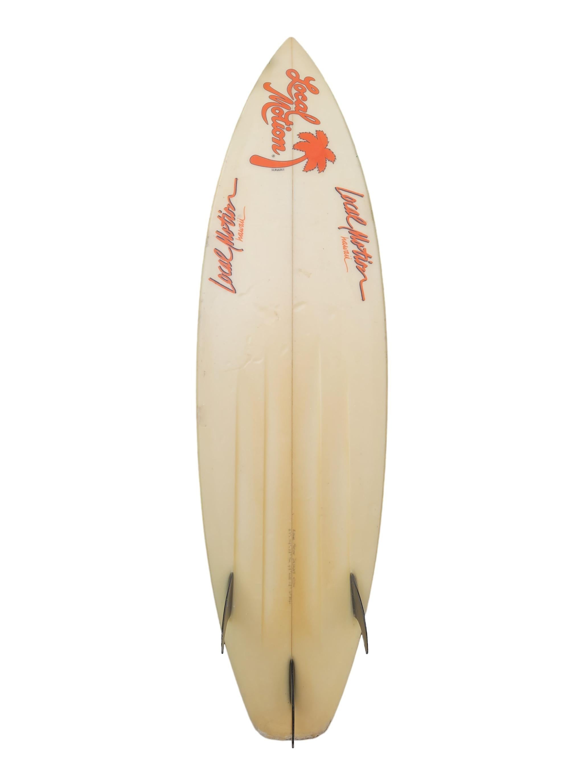 Vintage 1980s Local Motion surfboard. Features neon airbrushed tribal artwork design with glass-on on thruster (tri-fin) setup. A great example of a unique 1980s Local Motion surfboard in all original condition. 