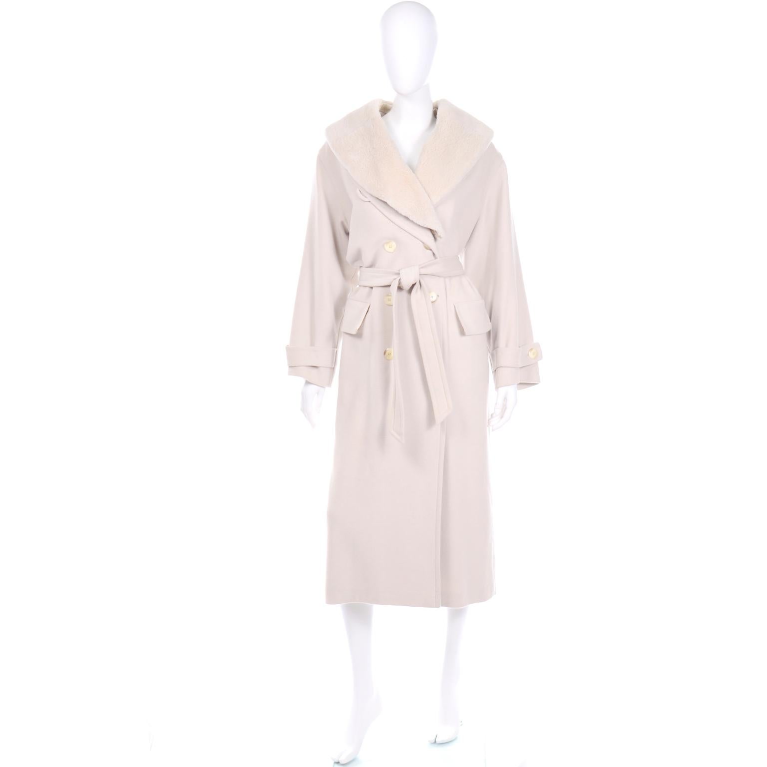 This vintage Louis Féraud double breasted cream coat is so versatile because it has a detachable plush faux fur collar. There is an extra button along the collar that you can fasten to have the fur inside. The cuffs have the same buttons and have an