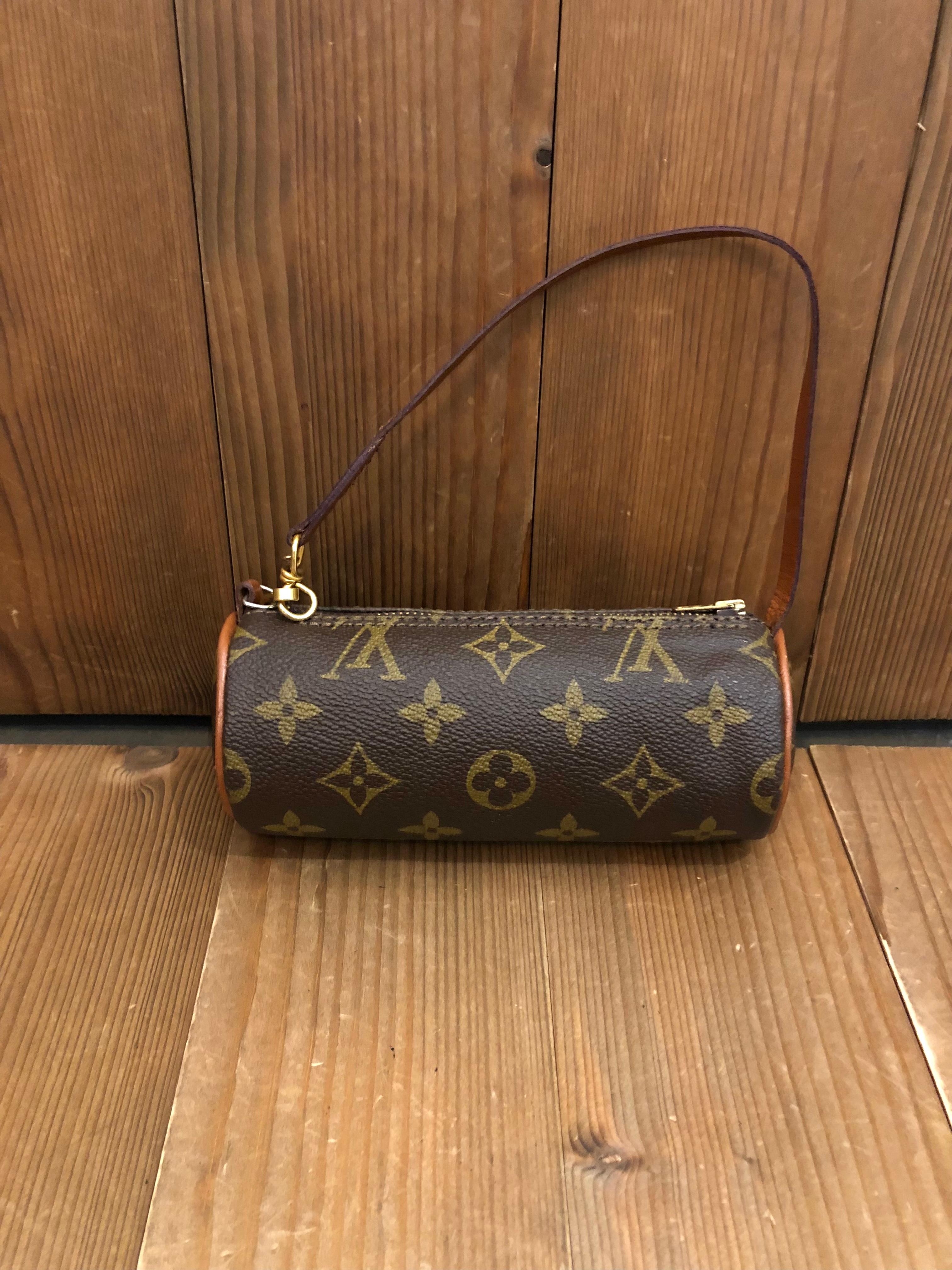 Vintage LOUIS VUITTON mini Papillon pouch in brown monogram canvas and leather. This mini papillon originally came with the mother papillon. Datecode stamped on the mother papillon and so this mini papillon pouch does not have a datecode. Vintage
