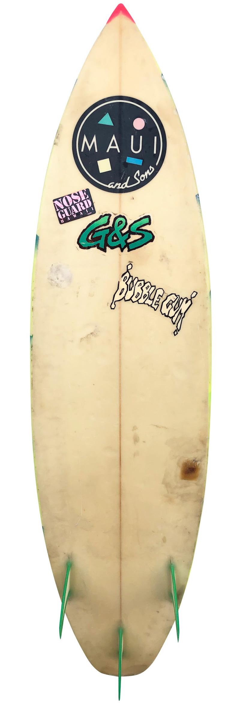 Early 1980s Maui & Sons shortboard surfboard. Features an amazing airbrush design indicative of the 1980s. Complemented by matching glassed on thruster (tri-fin) setup. An incredible example of a colorful 80s surfboard made by the iconic Maui and