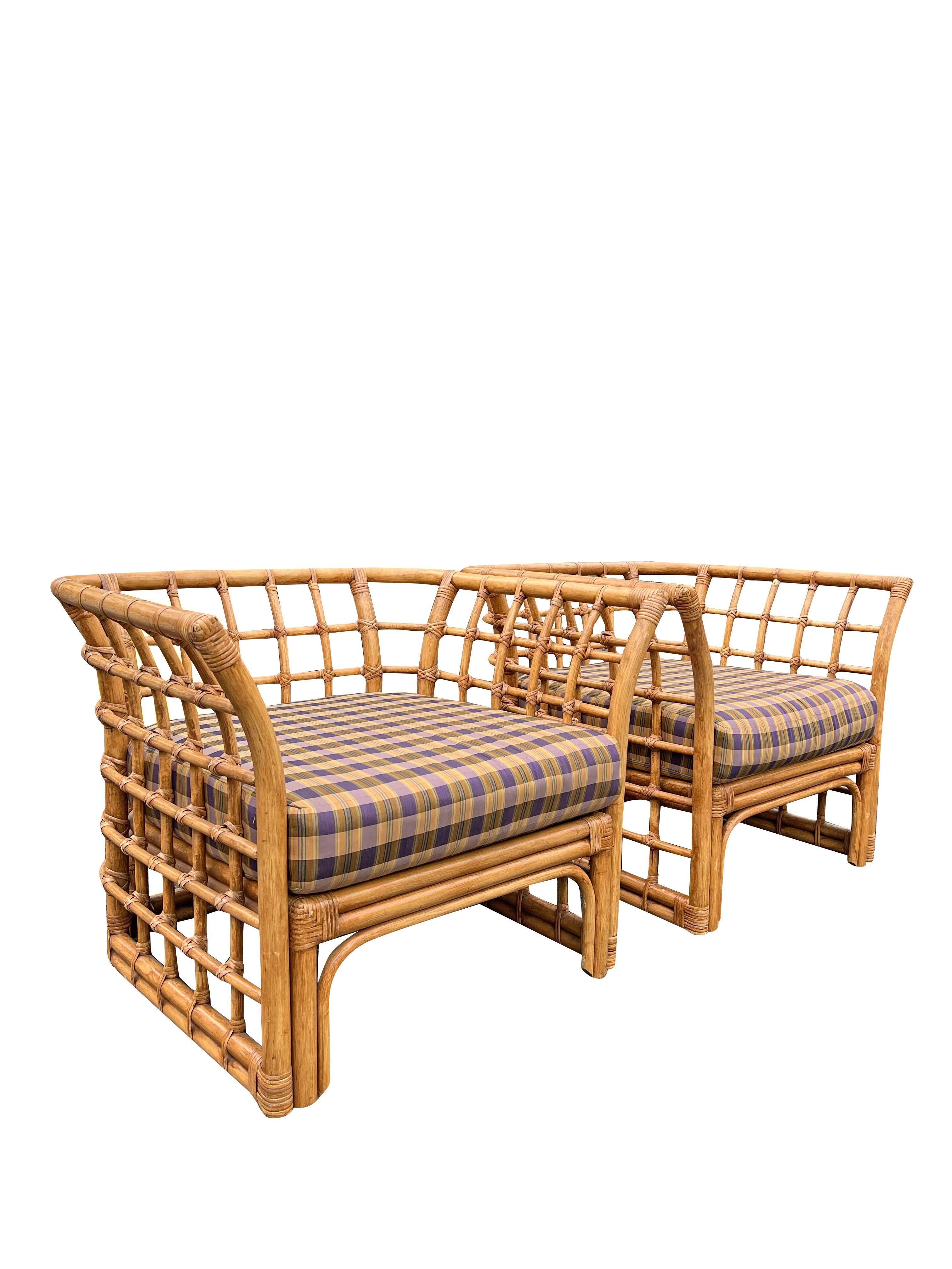 This comfortable and stylish vintage wicker seating set is perfect for adding a touch of boho chic to your home. Designed by Henry Link, a renowned name in wicker furniture, this set features a pair of large chairs and a matching ottoman. The