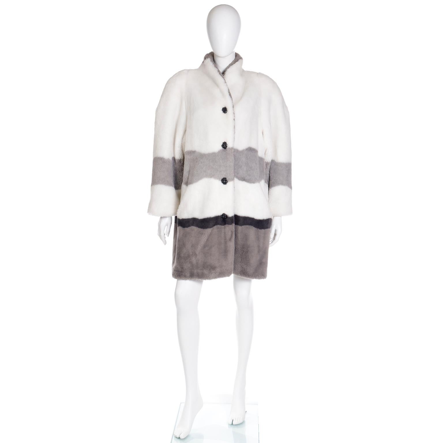 This rare vintage New York City Skyline faux fur coat is in sophisticated shades of white, black and grey. This is one of those coats that would make any vintage lover swoon and for those who've never ventured into the vintage realm, this coat might