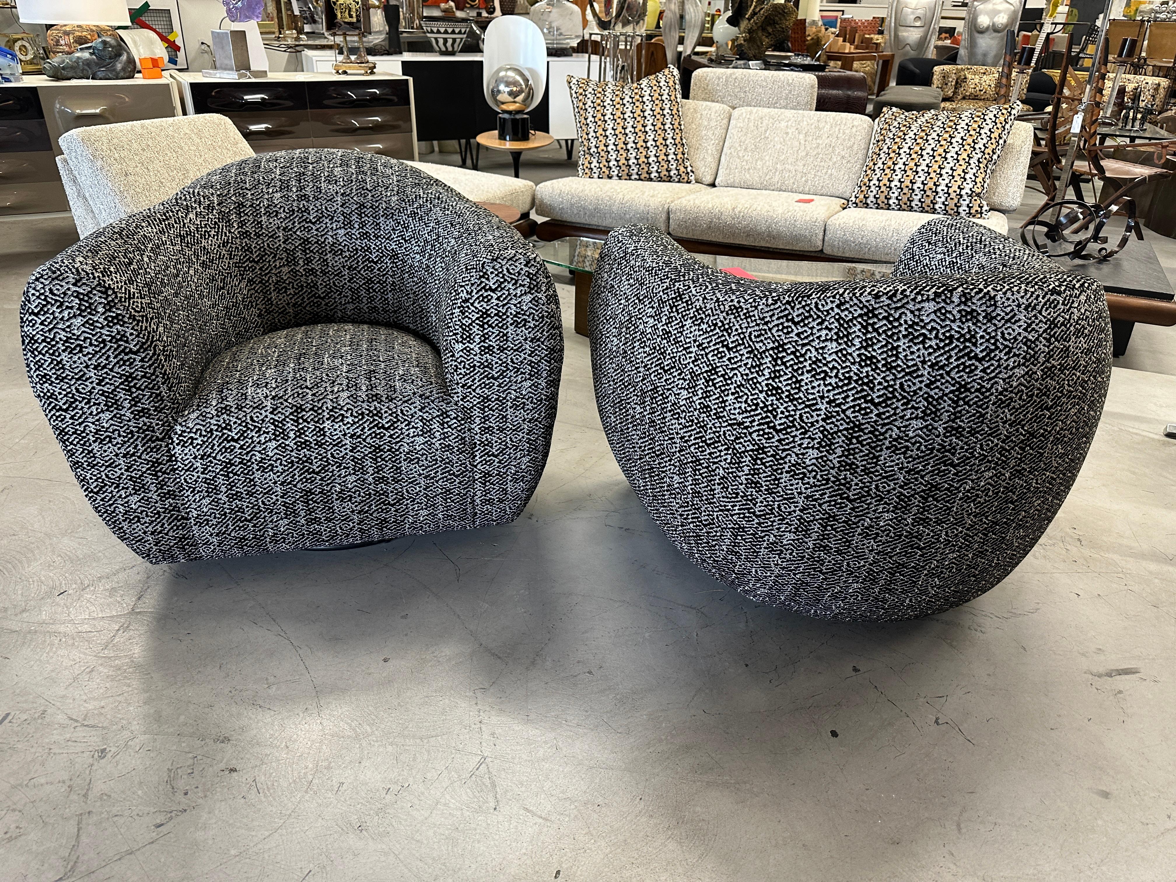 A running pair of oversized barrel swivel chairs from the 1980’s we’ve had totally redone in a beautiful cut velvet fabric by Pollack Weitzner called Precipice in the Phantom colorway.  The swivel bases have even been replaced and there are