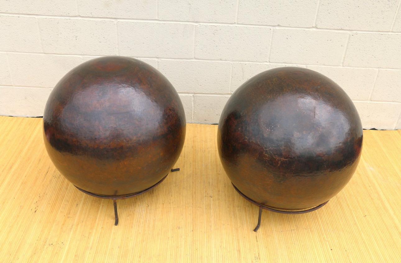 Spectacular pair of spheres made of Copper and designed by Robert Kuo in the 1980s. They are in vintage condition. One of them is hit on one side, ( not a big deal), and the other has a lighter part, (check it out in the pictures provided). 
They