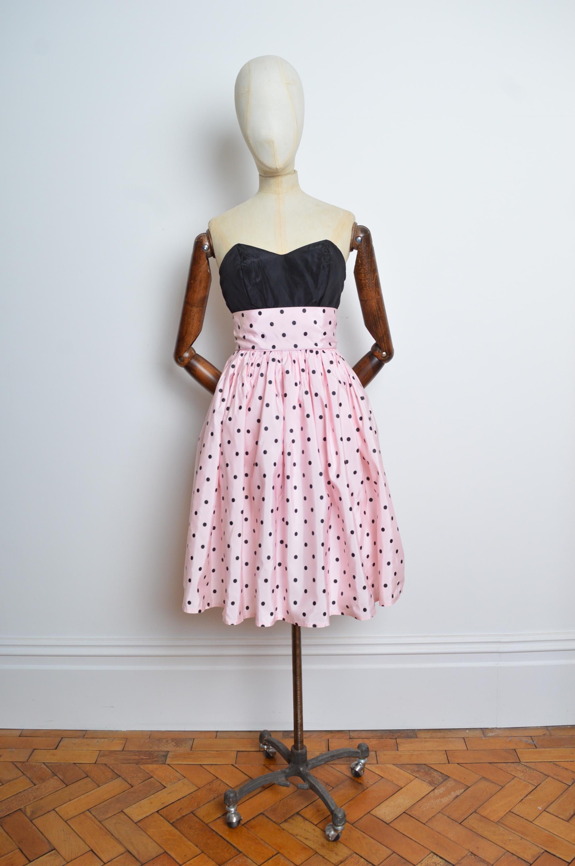 A Charming Vintage Pastel Pink Taffeta Cocktail Dress with a polka-dot print by 1980's Label 'Yessica'.
Features; Strapless / Fitted waist line / Puff-ball Skirt and Concealed zip up back.
Recommended Size; UK6.
Measurements are provided in inches
