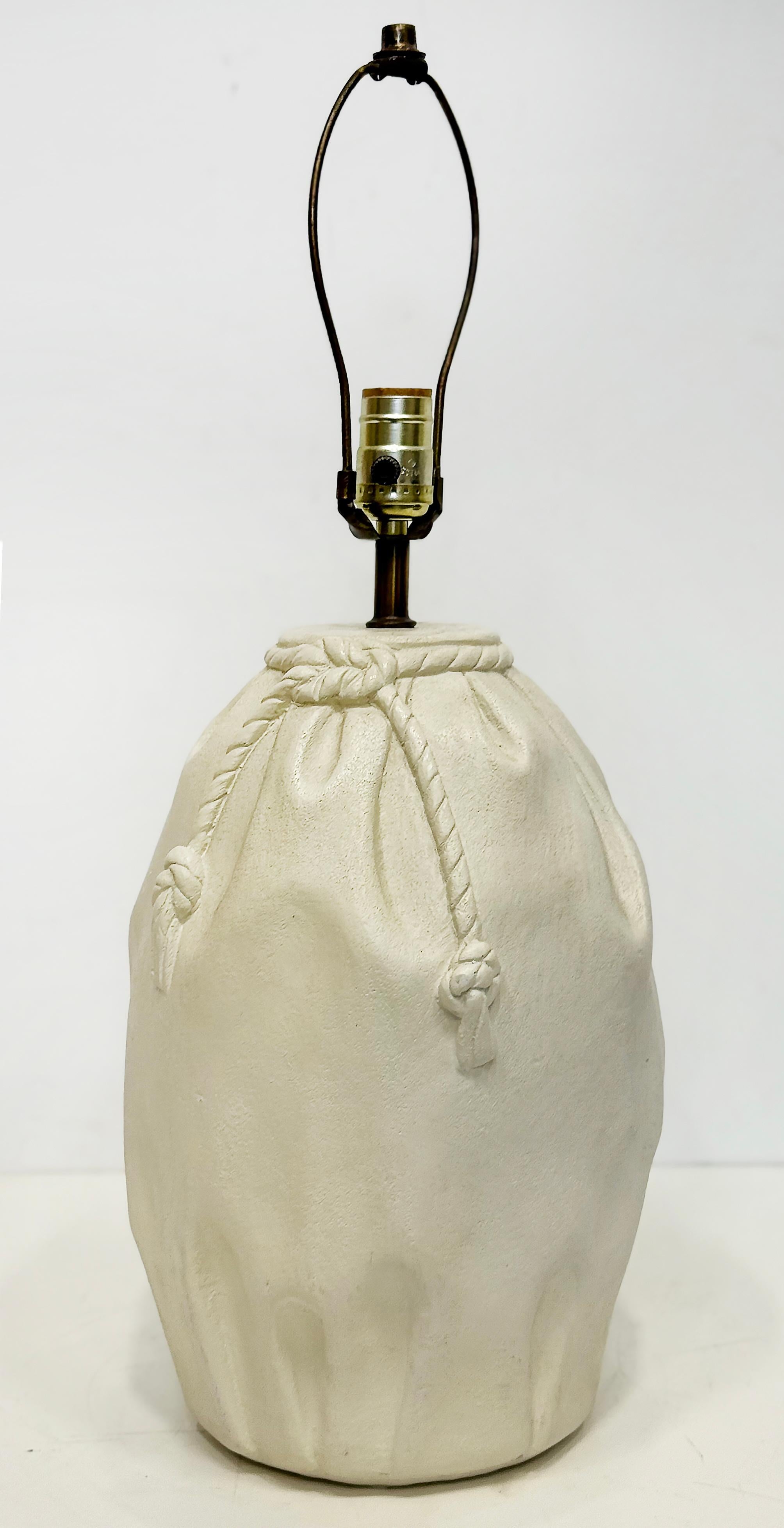1980s Vintage Plaster Bag, Rope Lamps in John Dickinson Style


Offered for sale is a a pair 1980s Vintage plaster paper bag with rope ties table lamps in the manner of John Dickinson. The lamps are in working condition.  The shades are not included