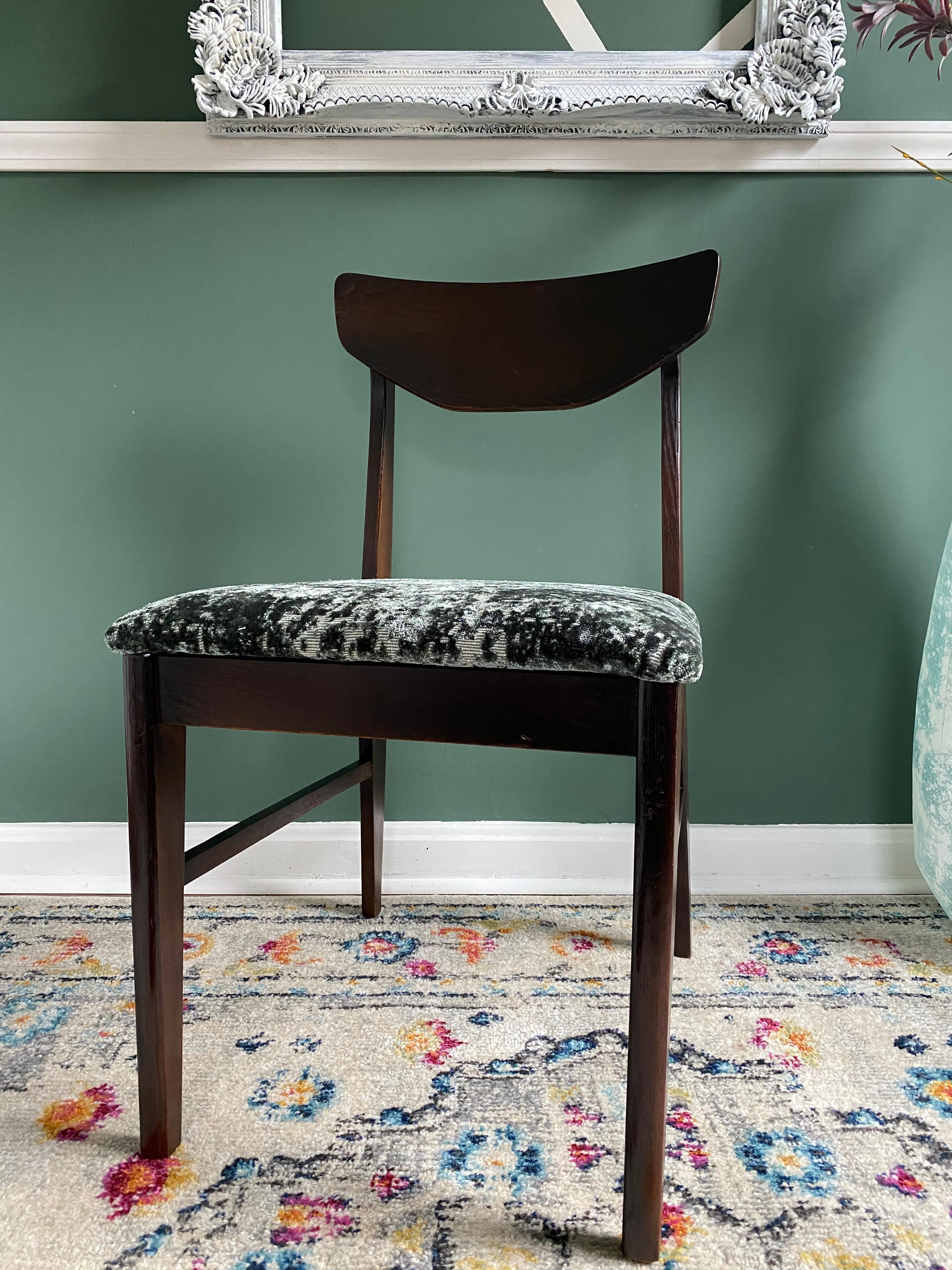 Beautiful reupholstered emerald green dark walnut MCM accent chair!! This chair was reupholstered in a emerald green velvet fabric by Anna Elisabeth. The wood was refinished in a dark walnut. Make this as an accent chair in your office, bedroom, or