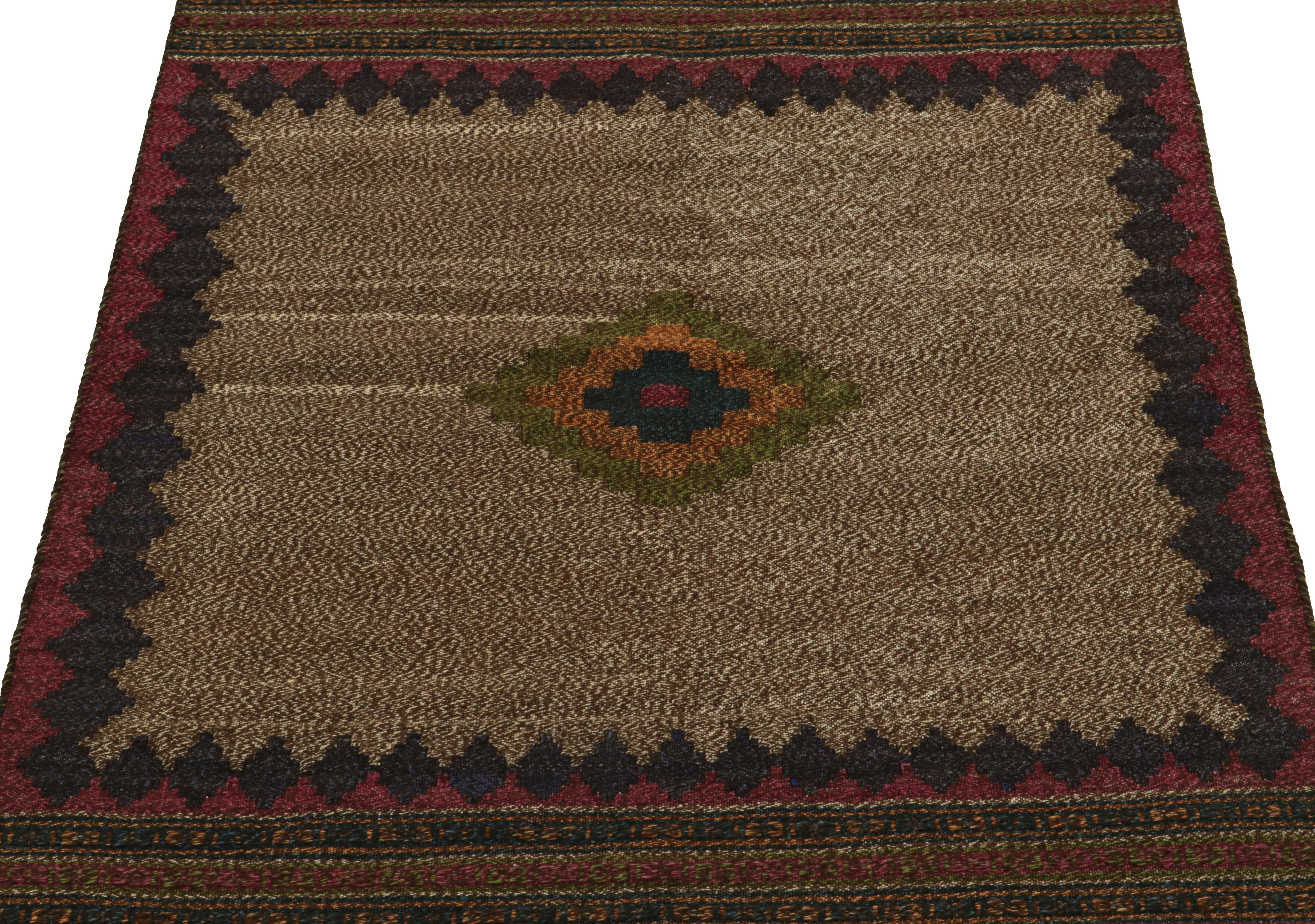 Handwoven in wool circa 1980-1990, from a rare vintage curation of small-sized Sofreh Kilim rugs joining our revered classics. A 3x4 distinguished among Persian flat weaves of its time for both its colors and durability. 

The piece carries a