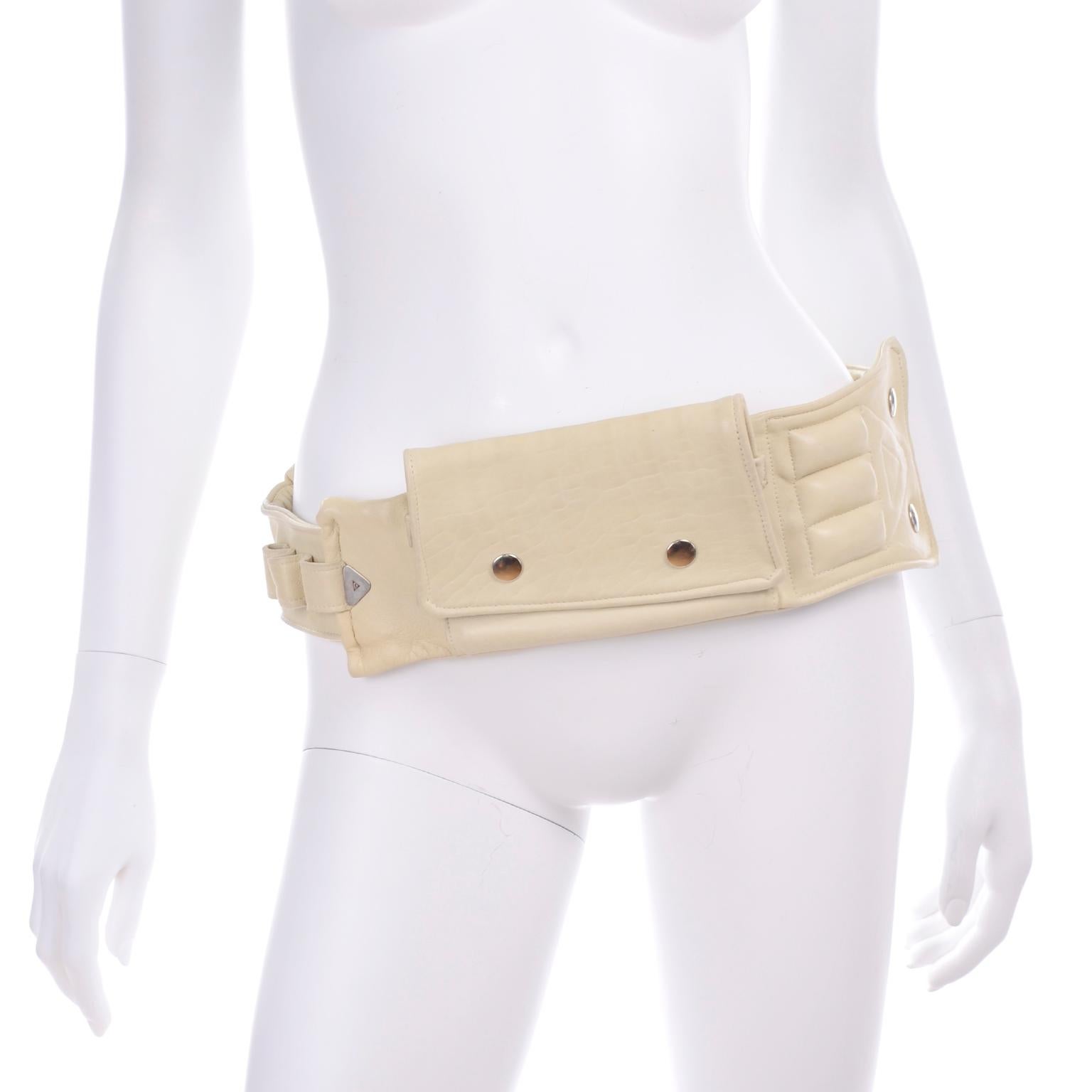 This gorgeous creamy lambskin leather belt can carry everything you need for a night out!  It has one big fold over pocket with one compartment inside and out, and 3 loops for a make-up brush or lipstick. Scovill style snap closures.  This belt came