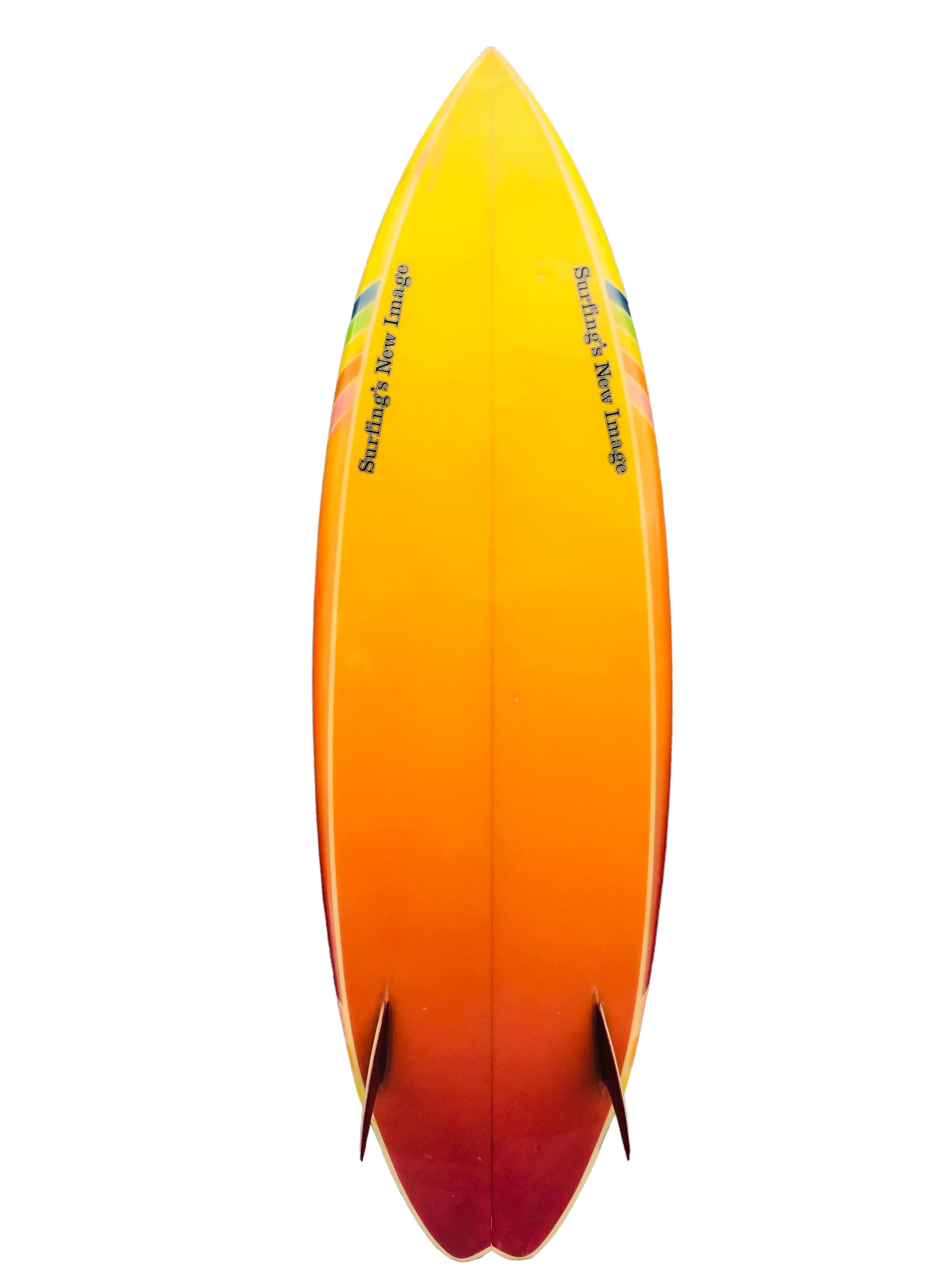 Early-1980s Surfings New Image twin fin surfboard made by Rick Hamon. Features a remarkable rainbow airbrushed work of art including glitter embellished fiberglass. Swallow tail with multi colored fixed twin-fin setup. A magnificent example of a