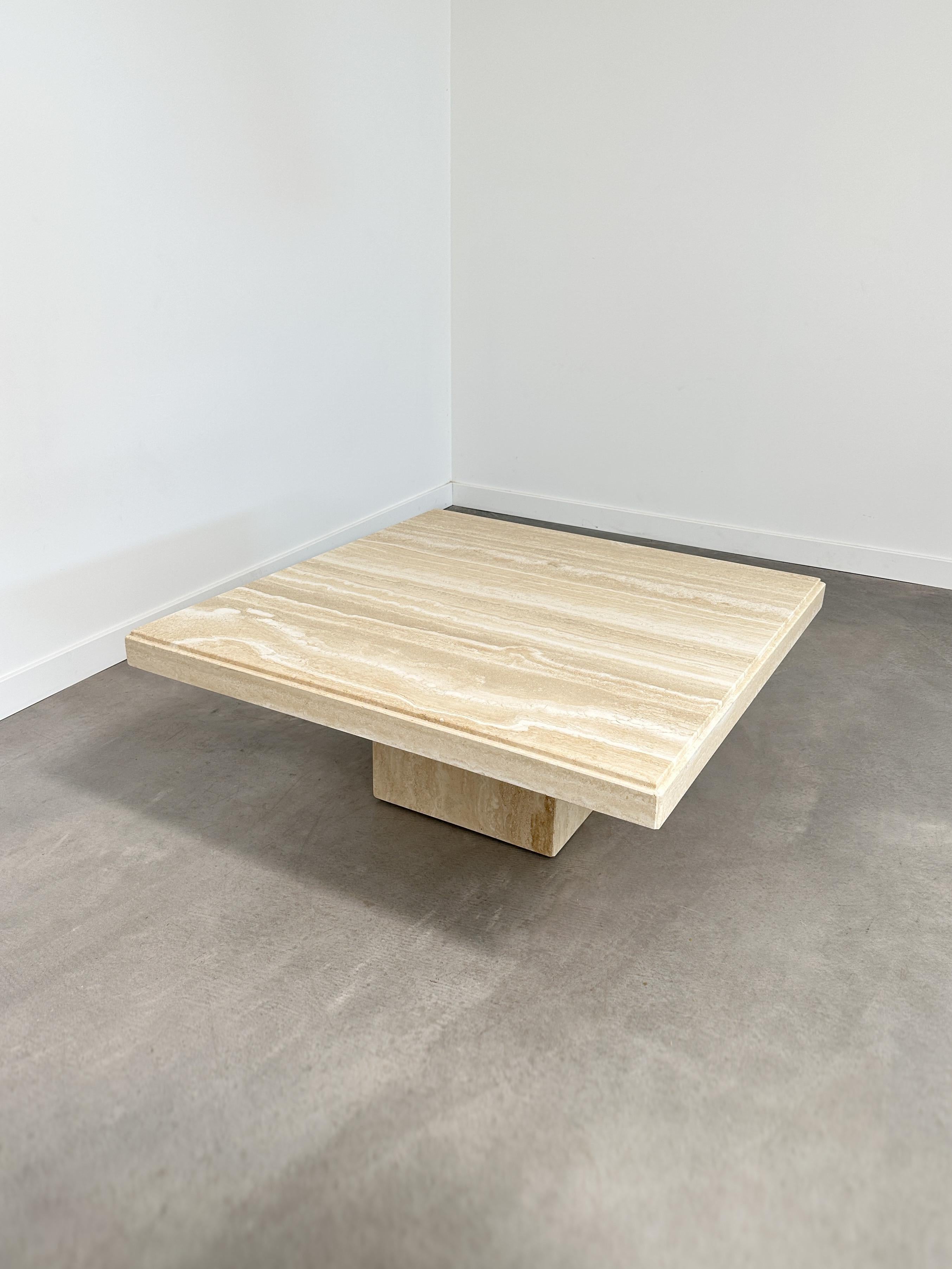 This 1980s travertine coffee table finds its voice in simplicity. With clean geometry, a hollow plinth base, and a beveled edge that catches light just so, it highlights the natural elegance of stone without saying too much.

Warm sand tones and