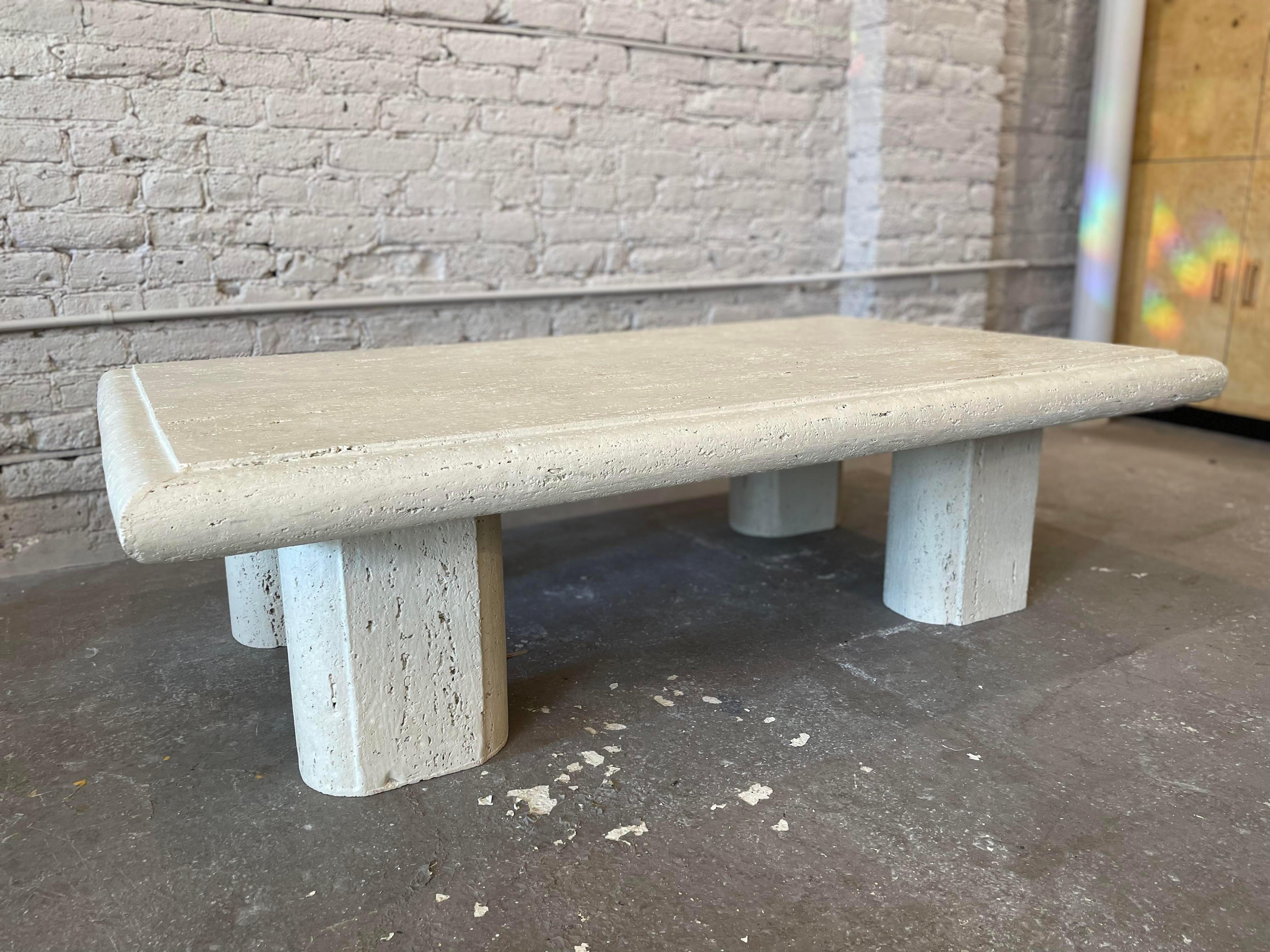Lovely coffee unfilled travertine coffee table with 4 oval legs which fit into slots on the top for total securement.

The travertine has a beautiful patina that only comes with age.