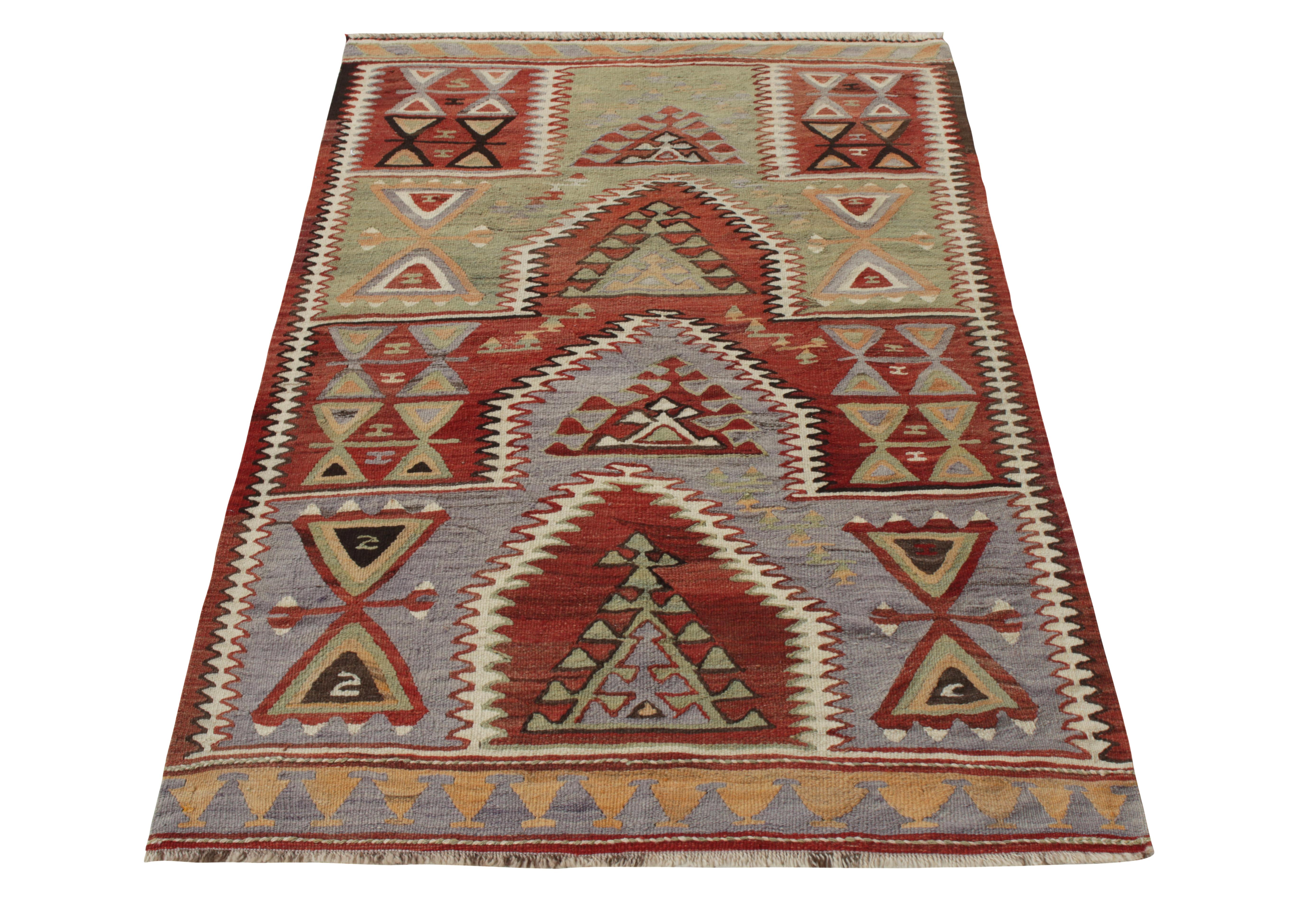 Handwoven in wool circa 1980-1990, a vintage 1980s Turkish Kilim from tmaking way to Rug & Kilim’s coveted classic flatweave collection. Spanning across a 4x6 scale, the piece enjoys a dexterous geometric pattern with motifs covering both the field