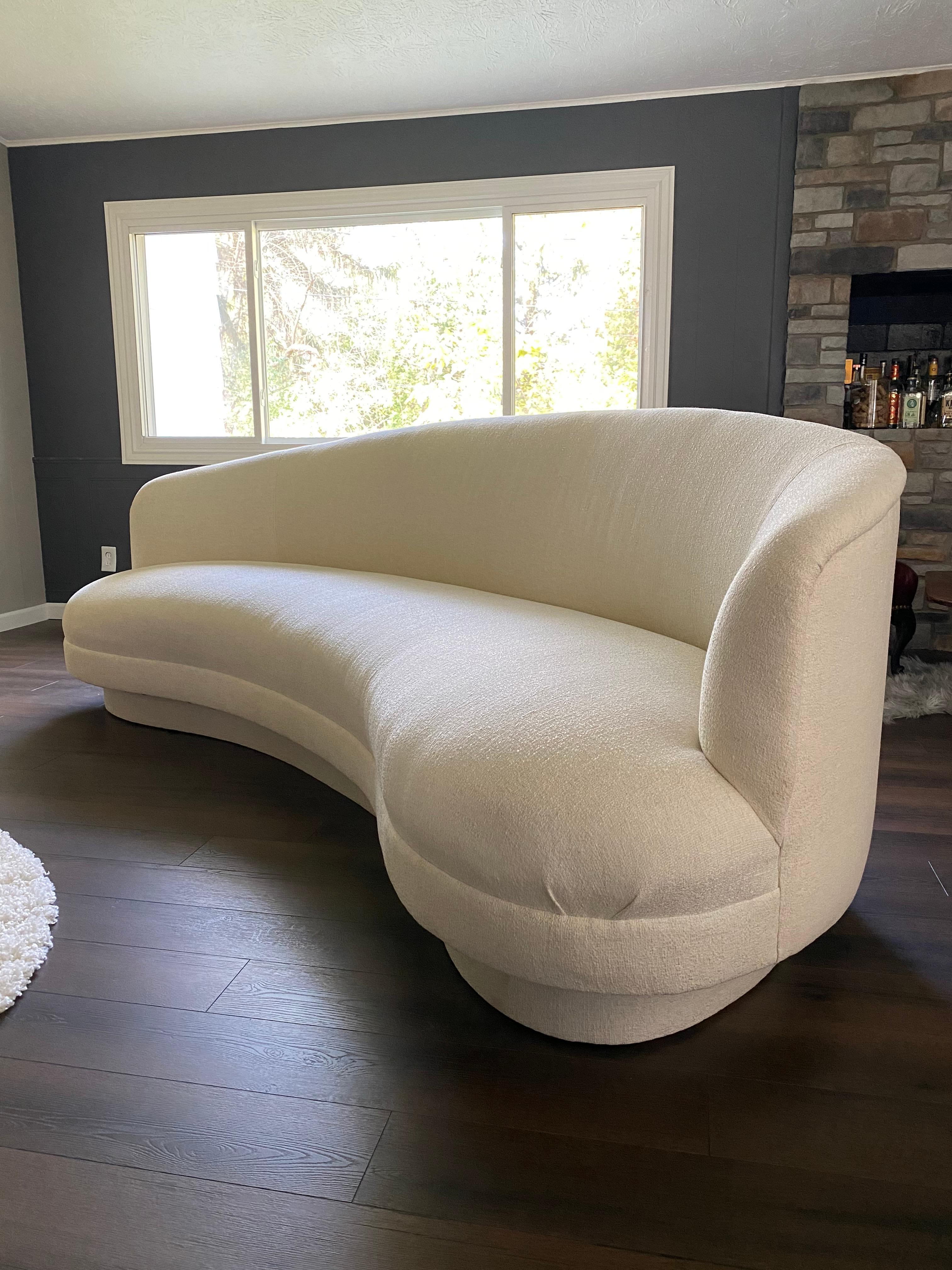 Beautifully reupholstered postmodern cloud sofa. This sofa is reupholstered using Crypton finished off-white boucle fabric, which offers a stain-resistant finish. All new foam and cotton batting as well. This sofa is perfect as a statement piece in