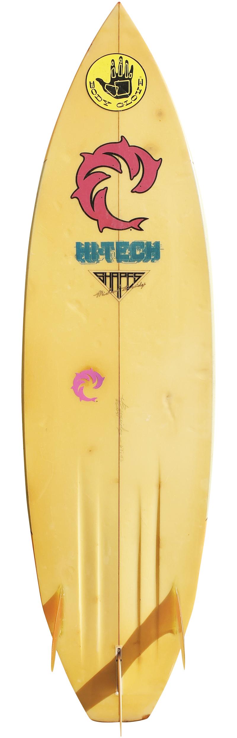 Mid-1980s vintage wave riding vehicles (WRV) surfboard shaped by Mike Beveridge. Features a retro airbrush design on deck, channel bottom, and thruster (tri-fin) setup. A great example of a 1980s short board in all original condition.