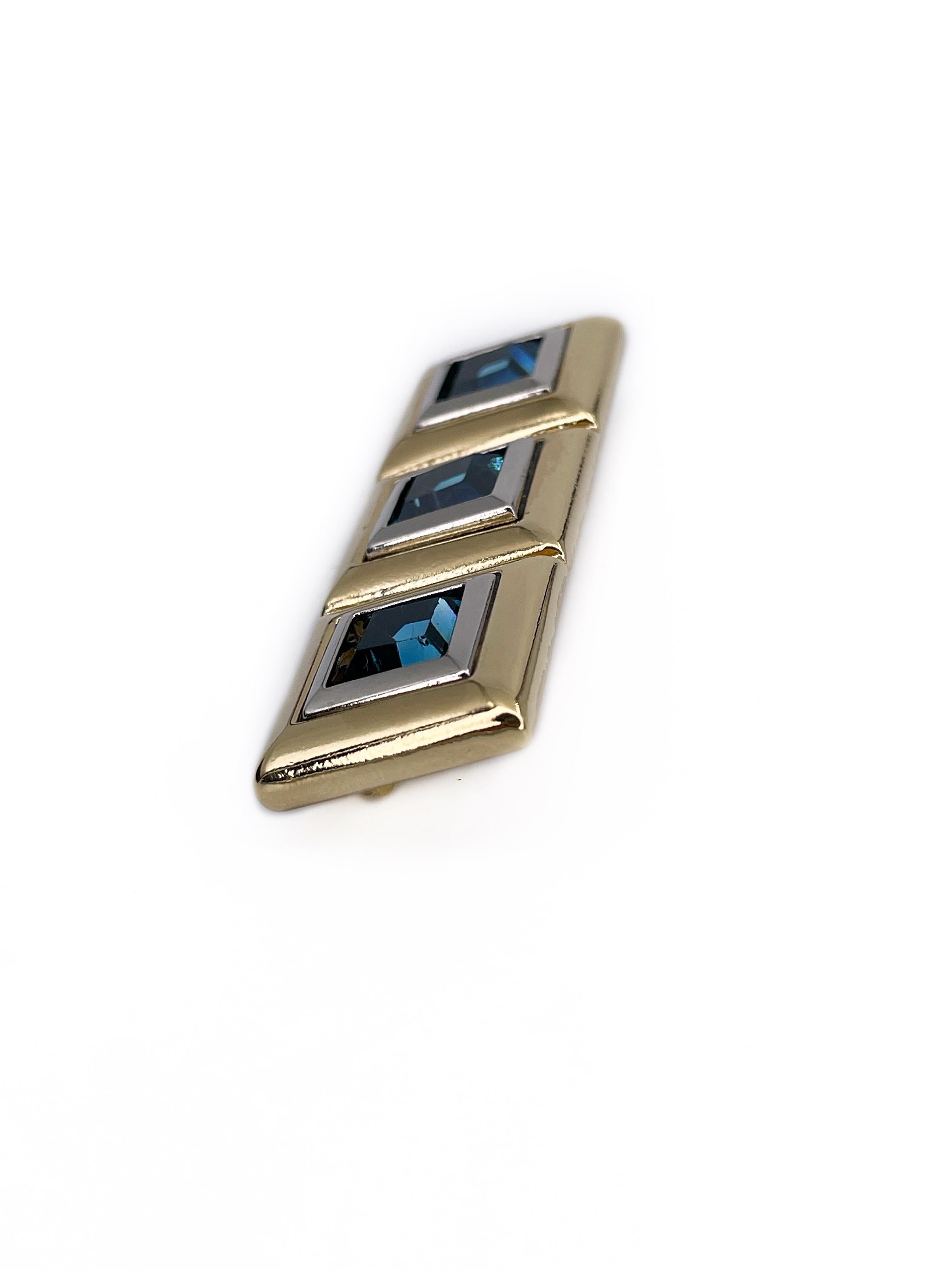 This is a vintage bar brooch designed by YSL in 1980s. The piece is gold and silver plated, adorned with light blue square rhinestones.

Markings: “YSL - Made in France” (shown in photos).

Size: 6x2cm

———

If you have any questions, please feel