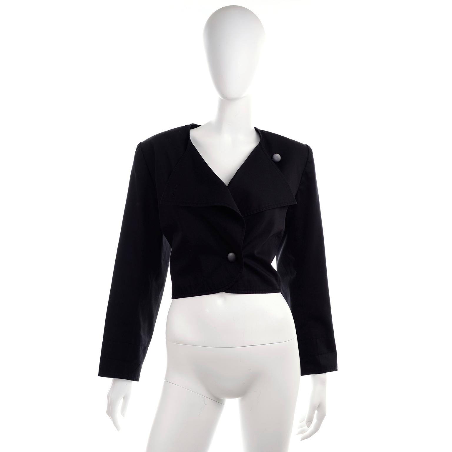 This is a great YSL vintage black long sleeve jacket with shoulder pads and front buttons.  The jacket is in excellent condition and was made in France. Labeled a French size 44 and includes the extra button sewn in side seam. Made in