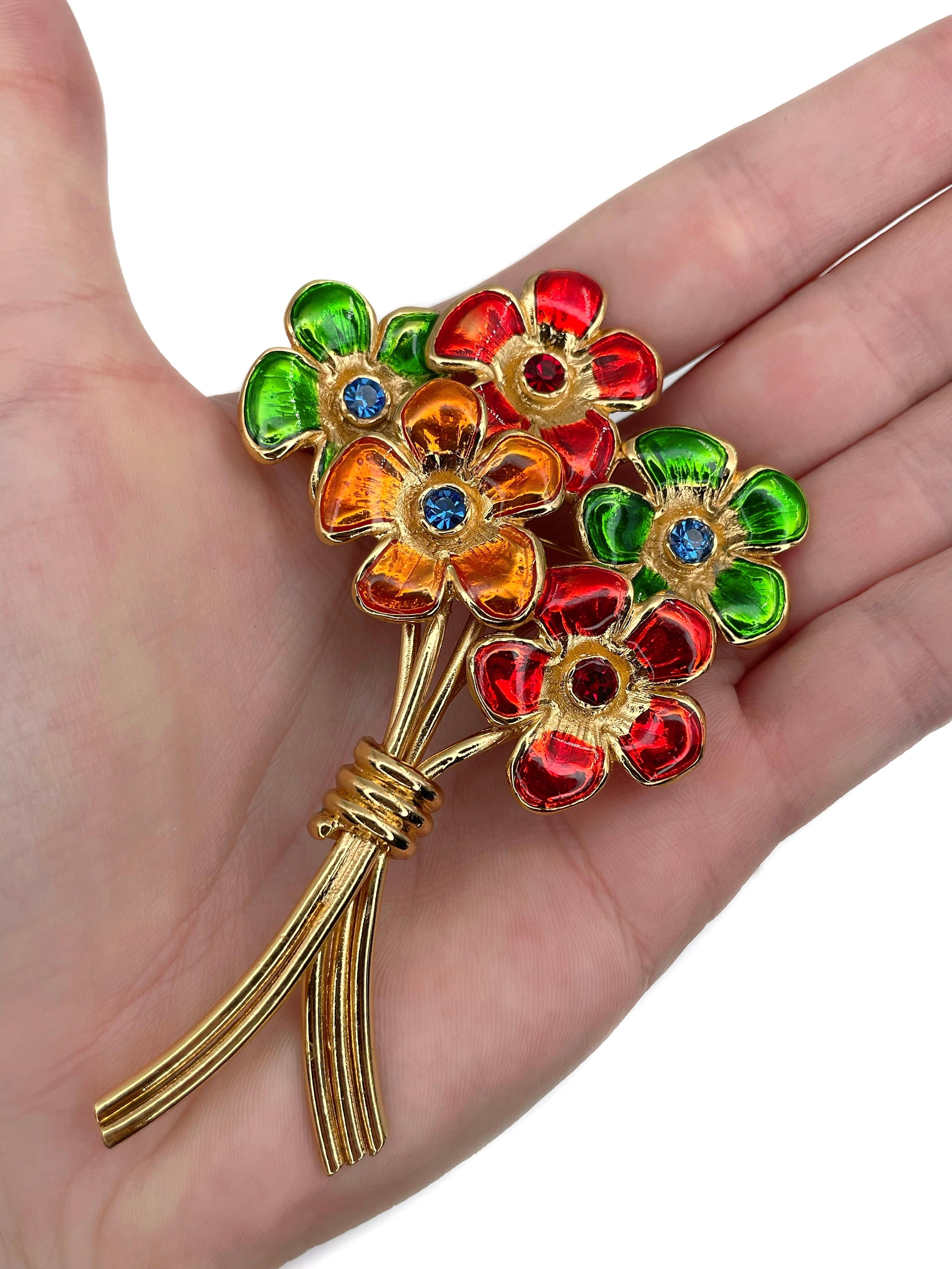 This is a gold tone flower bouquet pin brooch designed by YSL in 1980’s. 

The piece is gold plated. It features colourful enamel and rhinestones. 

Signed: “YSL. Made in France” (shown in photos).

Size: 9x5.8cm

IMPORTANT: As a buyer, you are