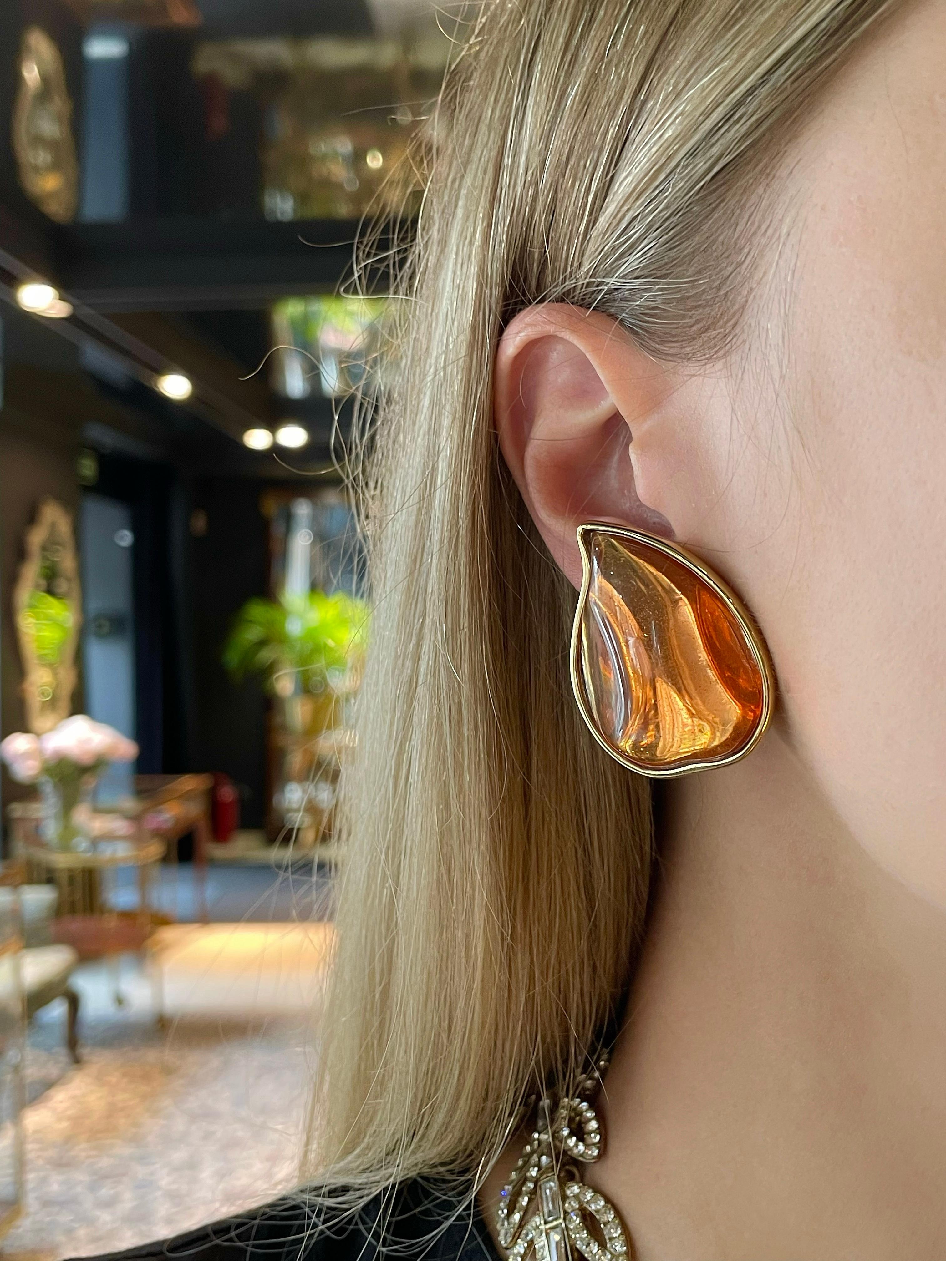 This is a playful pair of clip on earrings designed by YSL in 1980��’s. The piece is gold plated and features orange resin. 

Signed: “YSL - Made in France” (shown in photos). 

Size: 4x3cm

———

If you have any questions, please feel free to ask. We