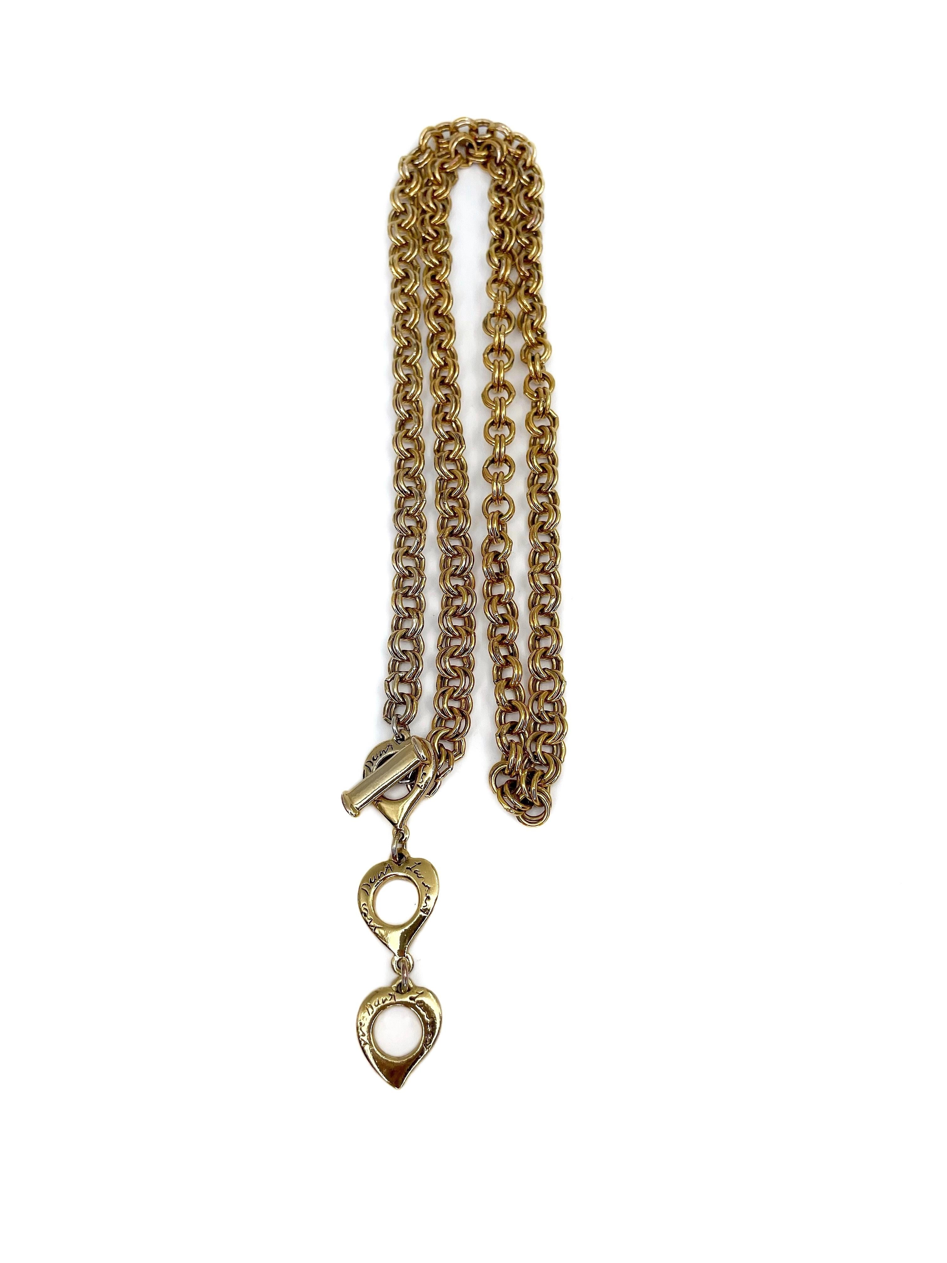 This is a vintage chain necklace designed by Robert Goossens for YSL in 1980’s. It is gold plated. 

The piece features three engraved hearts to adjust to the chosen length. The backs of these details has minor abrasions that appeared while using