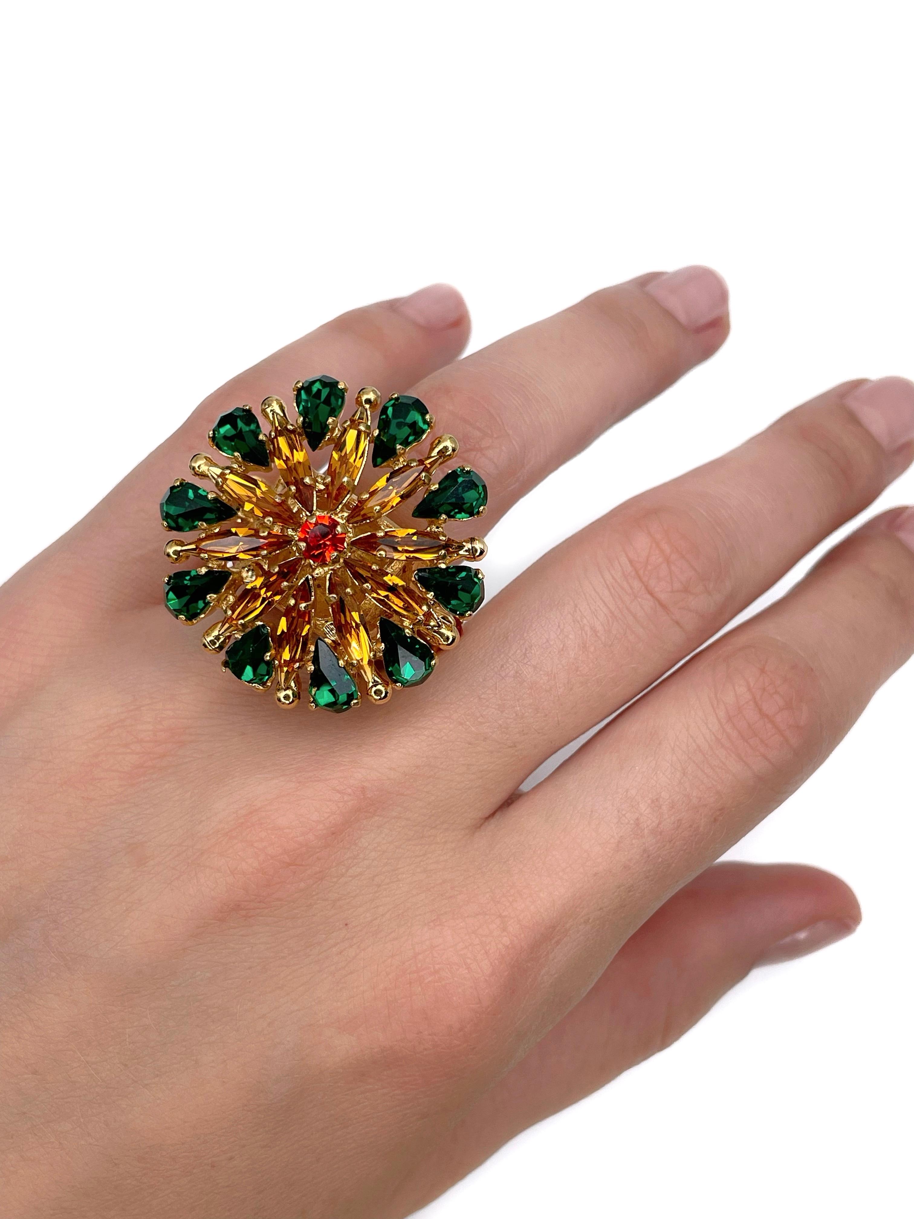This is an amazing vintage floral cocktail ring designed by YSL in 1980s. The piece is crafted in gold tone metal. It features green and orange shiny crystals. 

Signed: “Yves Saint Laurent” (shown in photos).

Size: 16.5 (US 6)
Head diameter:
