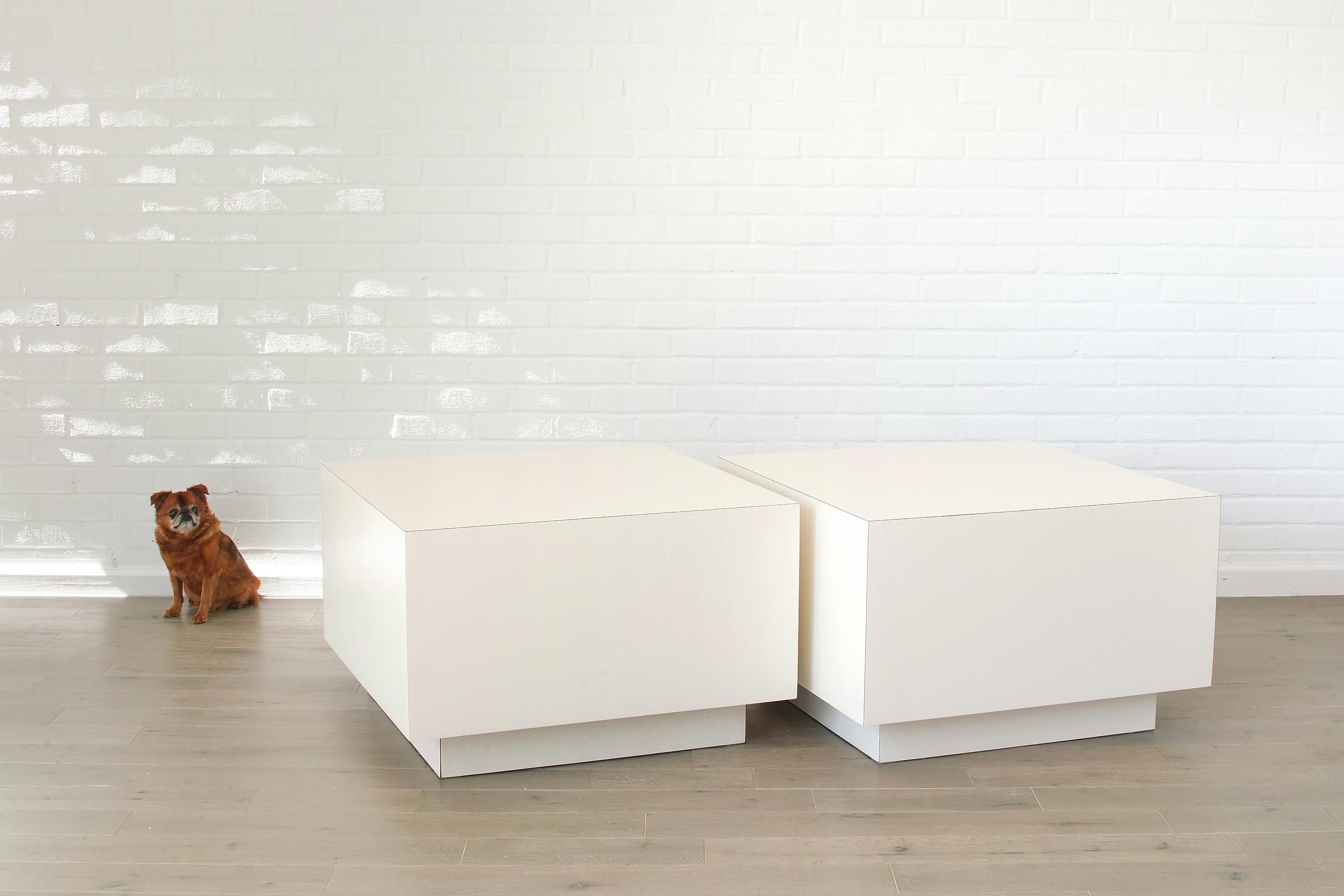 For your consideration is this 1980s White Formica Square Plinth Base End Tables. They are generously proportioned at 30 square inches, providing a clean spacious surface for your arranged objects. The white formica has a nice 80s aesthetic while