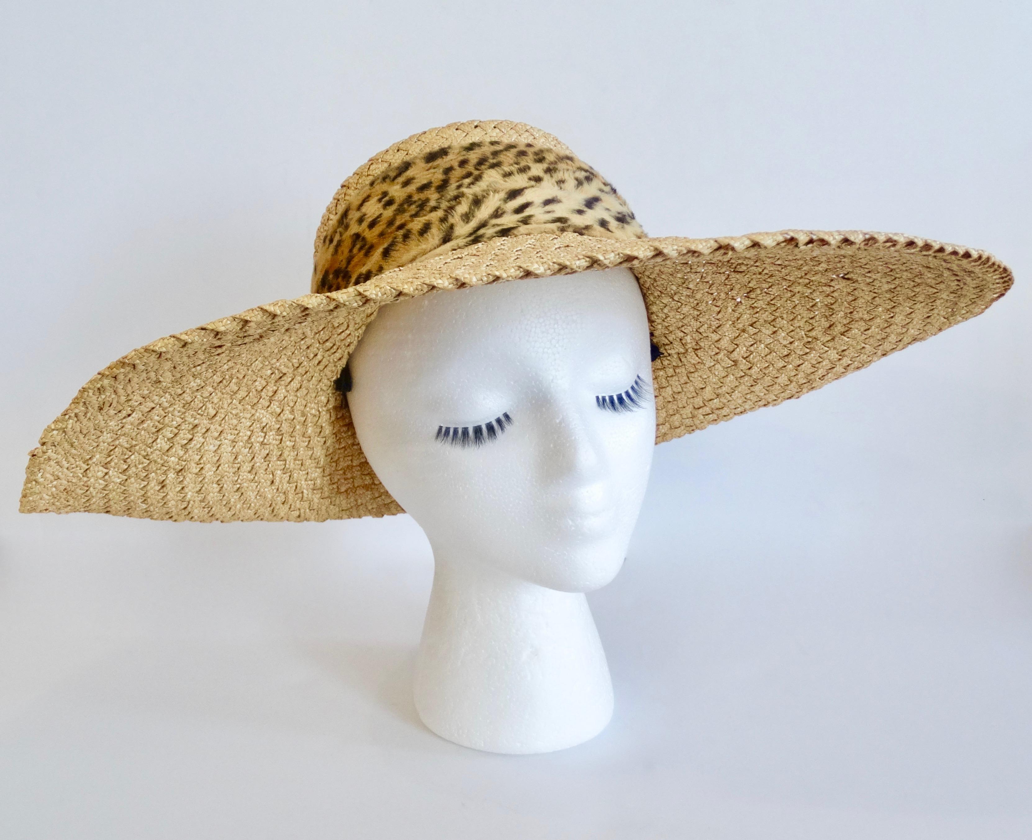 Make a fashion statement with this amazing Whittall & Shon hat! Circa 1980s, this straw hat features a wide asymmetrical propped brim and a faux fur cheetah print band. Chic, timeless and fabulous! This sun hat is sure to turn heads on your next