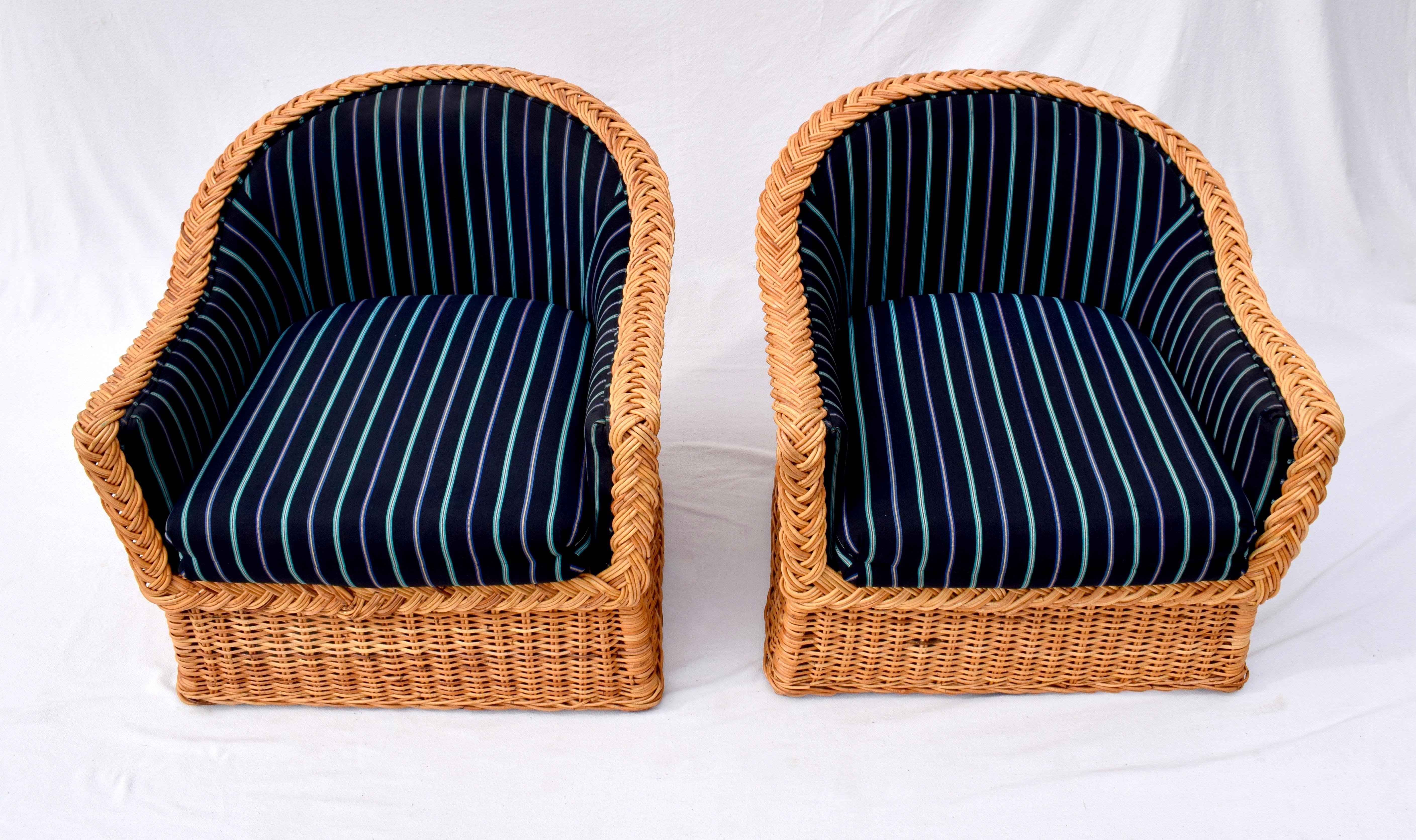 A large pair of vintage Wicker Works braided wicker club chairs from the 1980s reupholstered in the late 1990's. These comfortable chairs are in clean well maintained condition with years of use left. Matching back cushions are included ( not