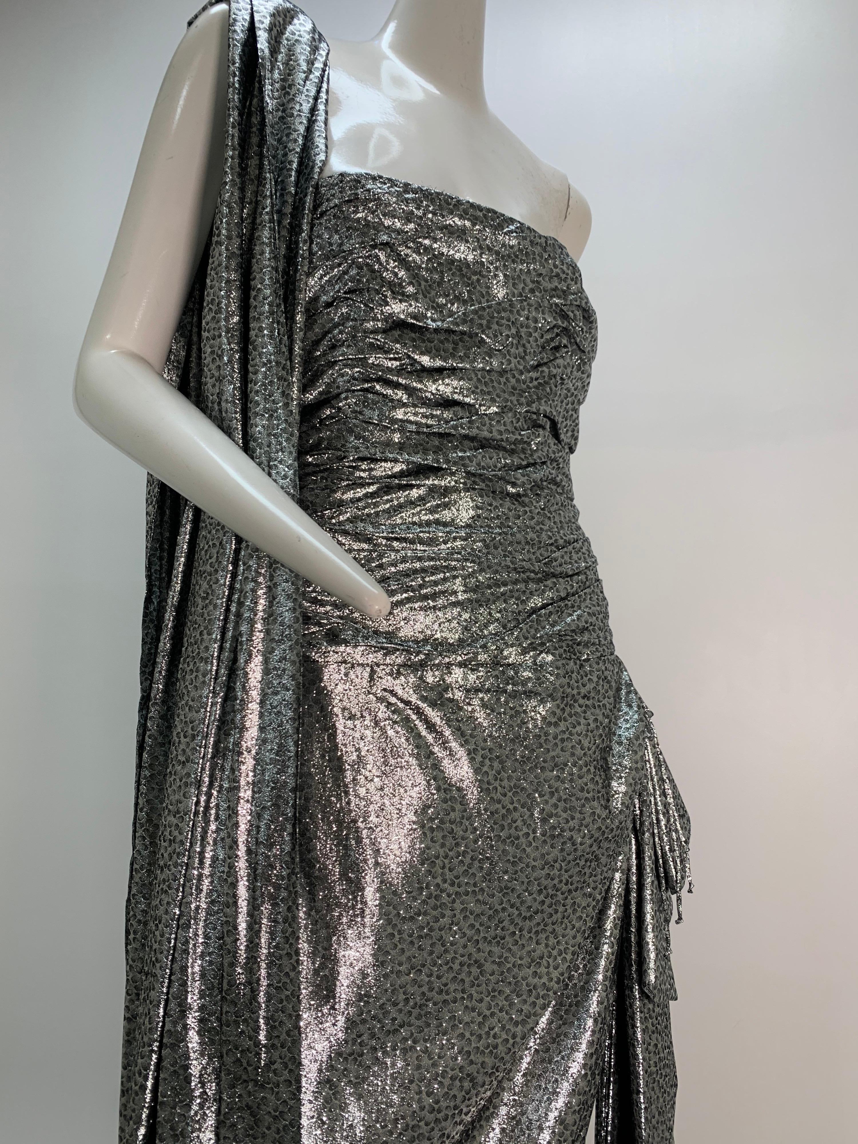 1980s William Travilla Strapless Corset-Bodice Gown in Silver Lame w/ Foulard: Boned strapless bodice is ruched to the hip with a swag caught up at a bow on the side. Back zipper. Matching original foulard is included. Asymmetrical hem for dramatic