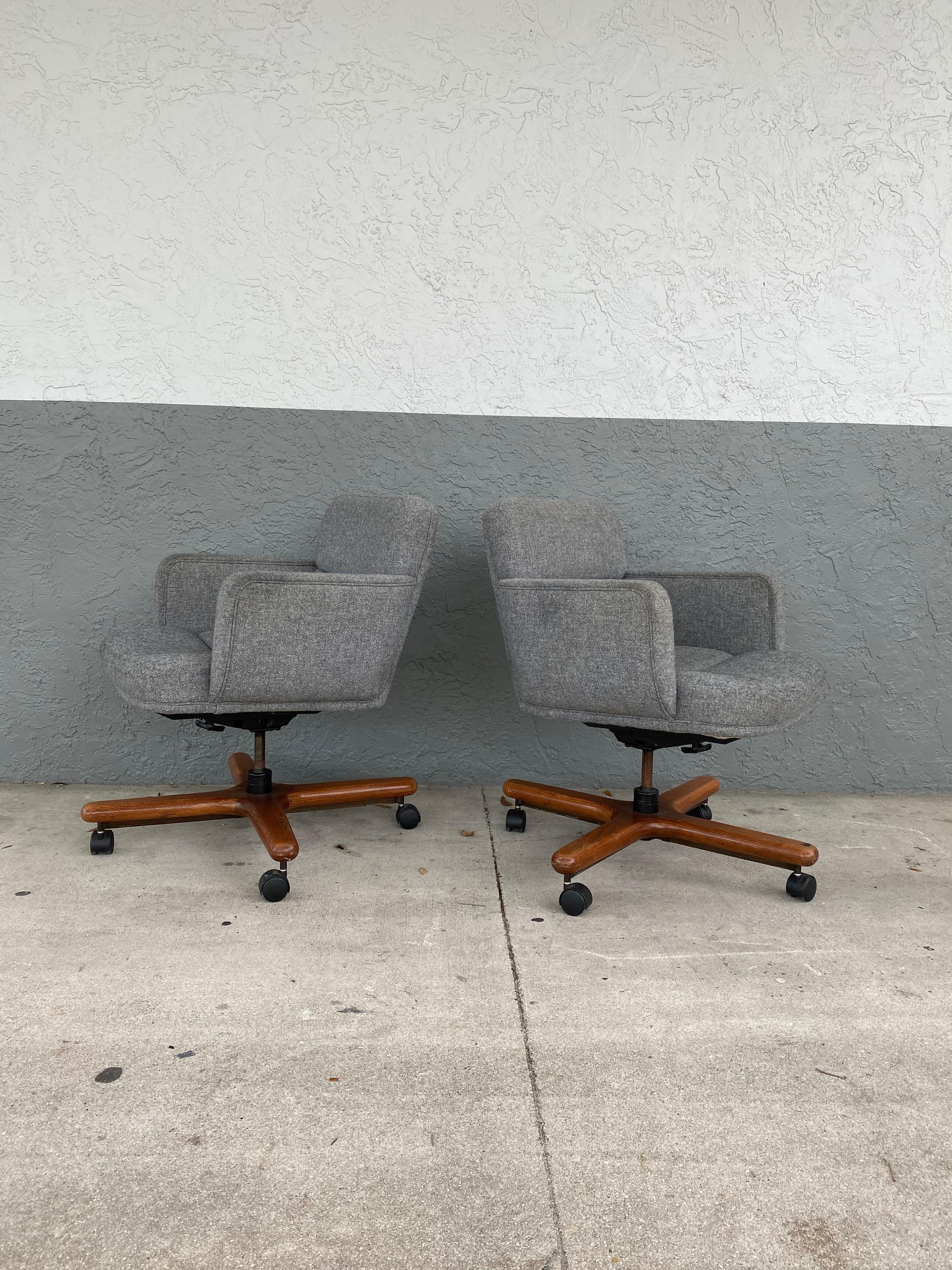 These timeless office swivel chairs are packed with personality! Outstanding design is exhibited throughout the monumental form. Post modern Style Swivel Chairs are beyond stunning. Sits on a wood swivel base. The sculptural shape also feature a