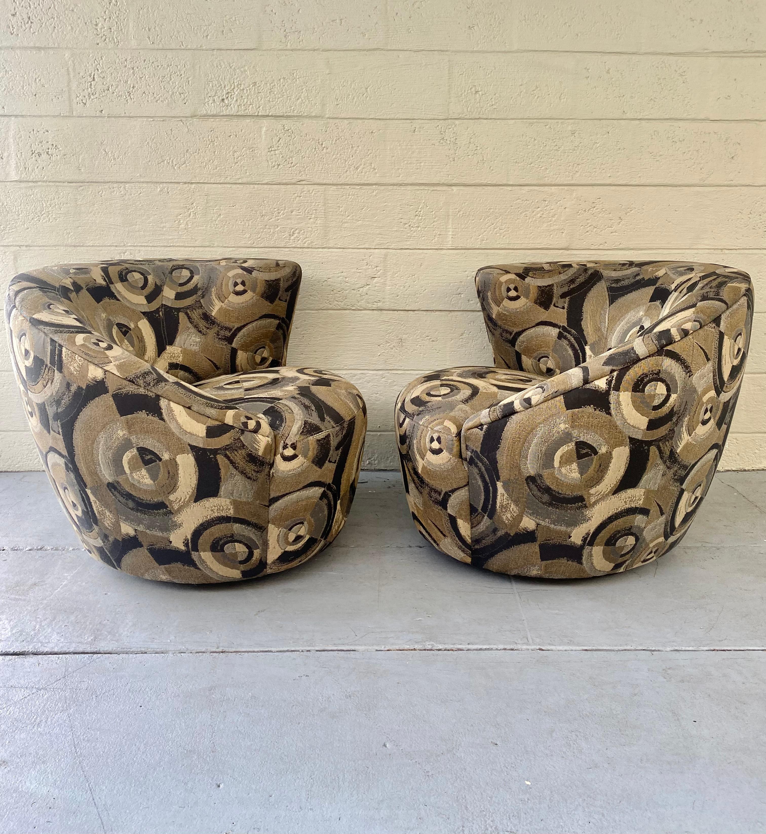 These rare XL Iconic swivel chairs are packed with personality! Outstanding abstract design is exhibited throughout the monumental form. Post modern Weiman swivel chairs are beyond cool. The unique corkscrew shape also feature a comfortable sculpted