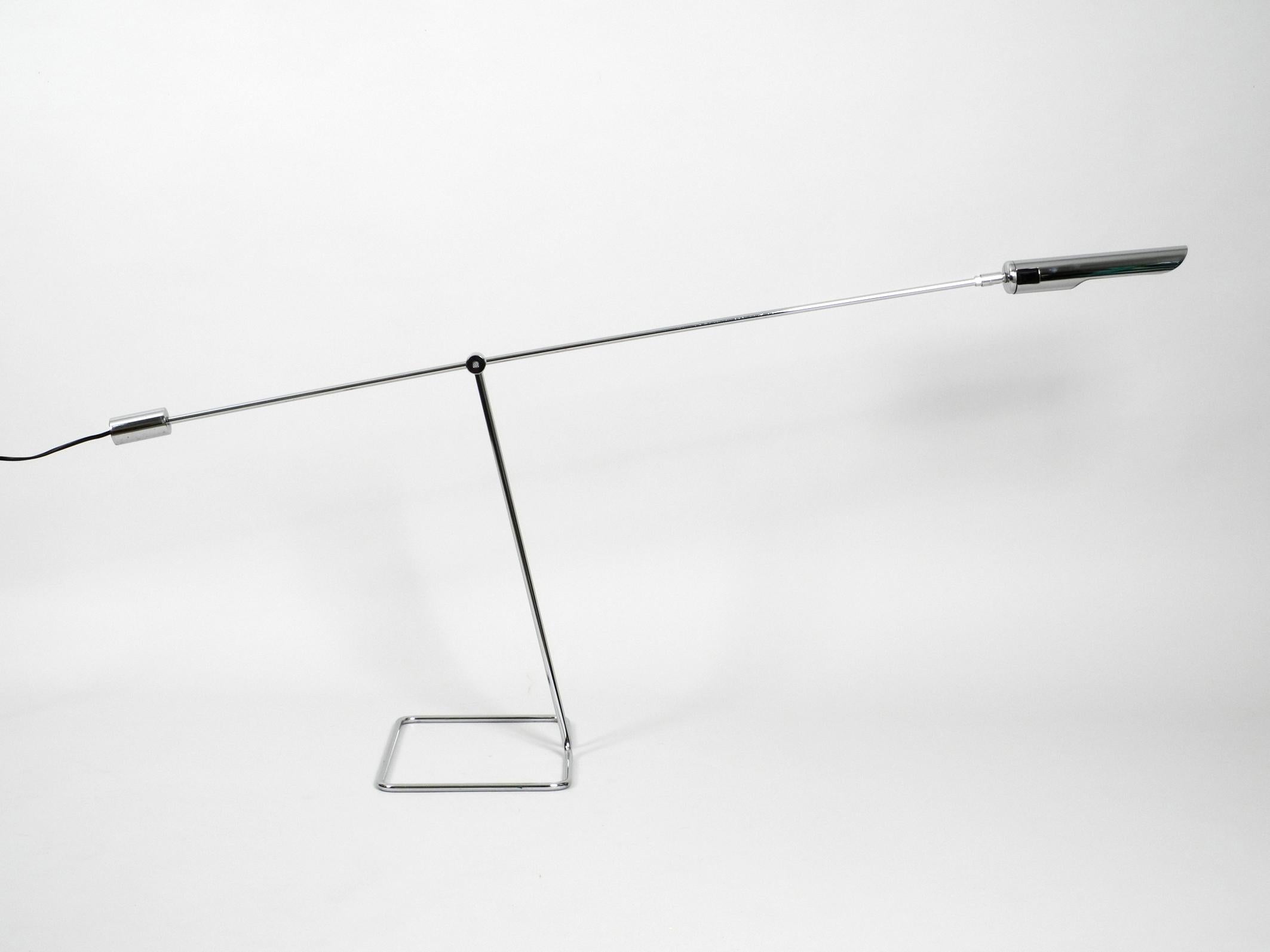 1980s extra large chrome metal floor reading lamp by Ikea Model Omi L 705. 
Extraordinary futuristic space age design. 
Floor lamp with free-adjustable arm and shade with counterweight.
Thought as a reading lamp for the couch. But also suitable