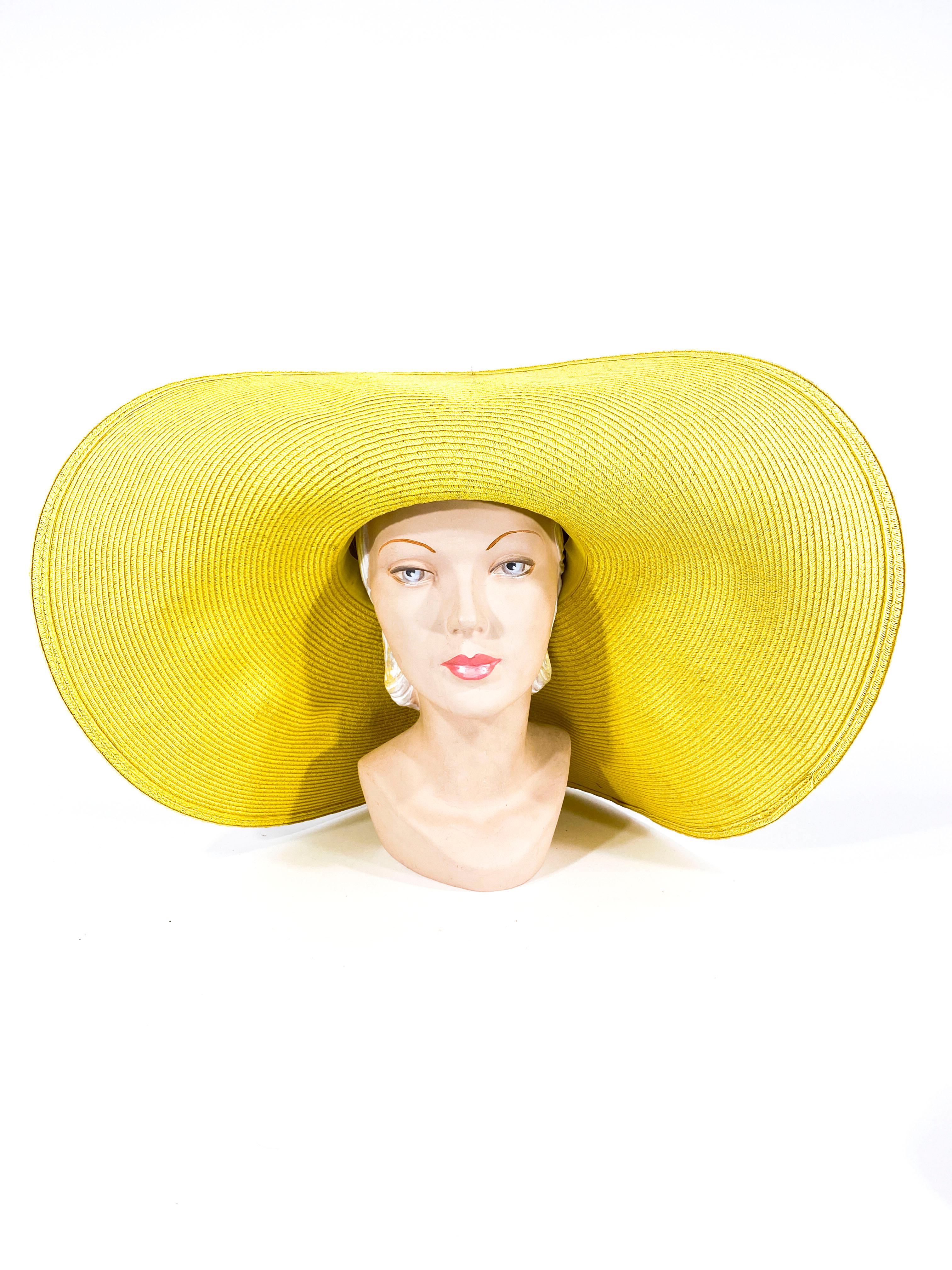 1980s yellow straw sunhat with an oversized unstructured brim and a custom made silk jersey printed hat band from original Leonard fabric. 