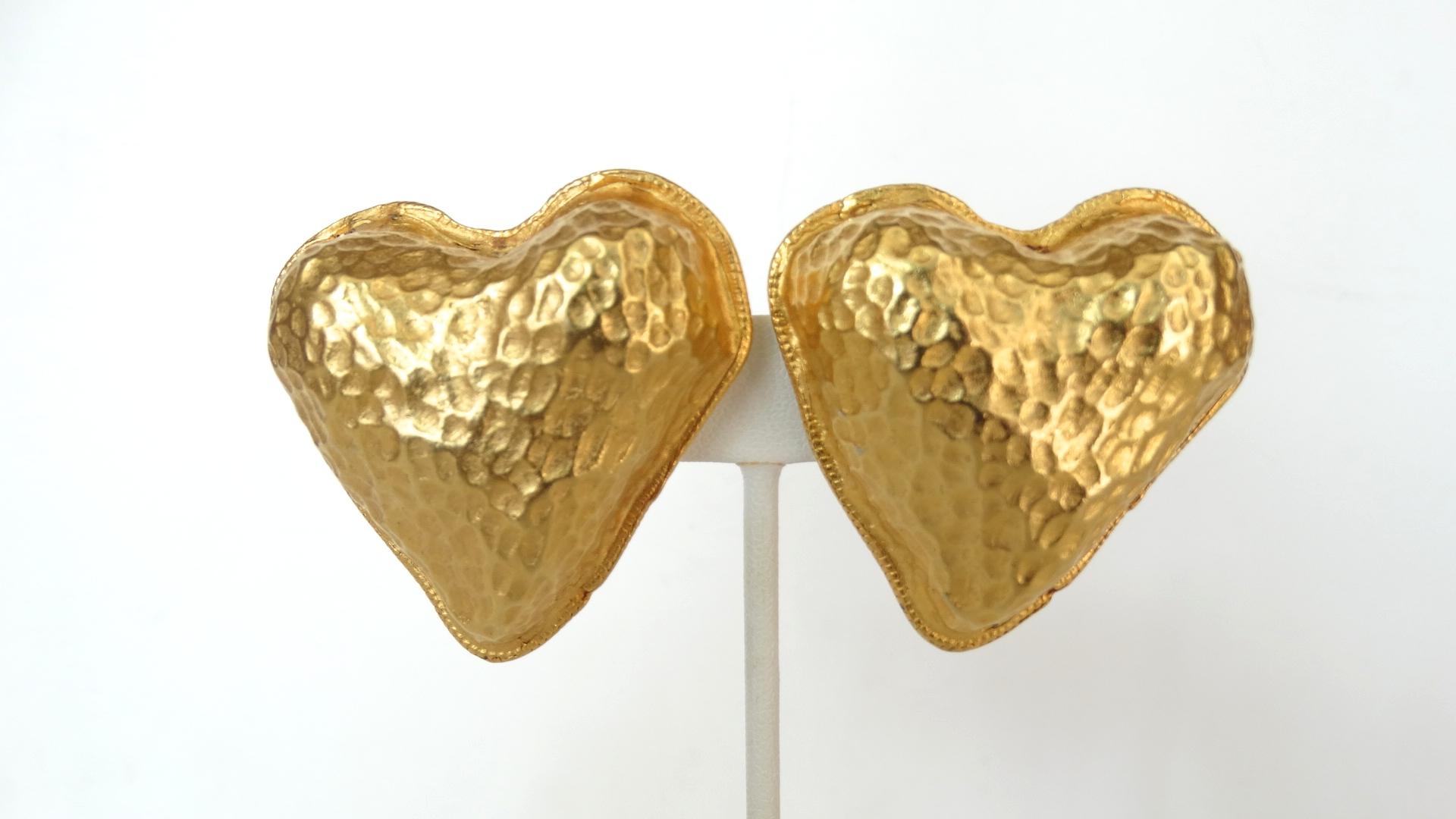 Feel The Love With These Amazing Heart Earrings! Circa 1980s, these gold plated Yosca clip-on earrings are in the shape of an abstract heart and features a textured trim and detailing on the front. The perfect pair of artsy earrings for your next