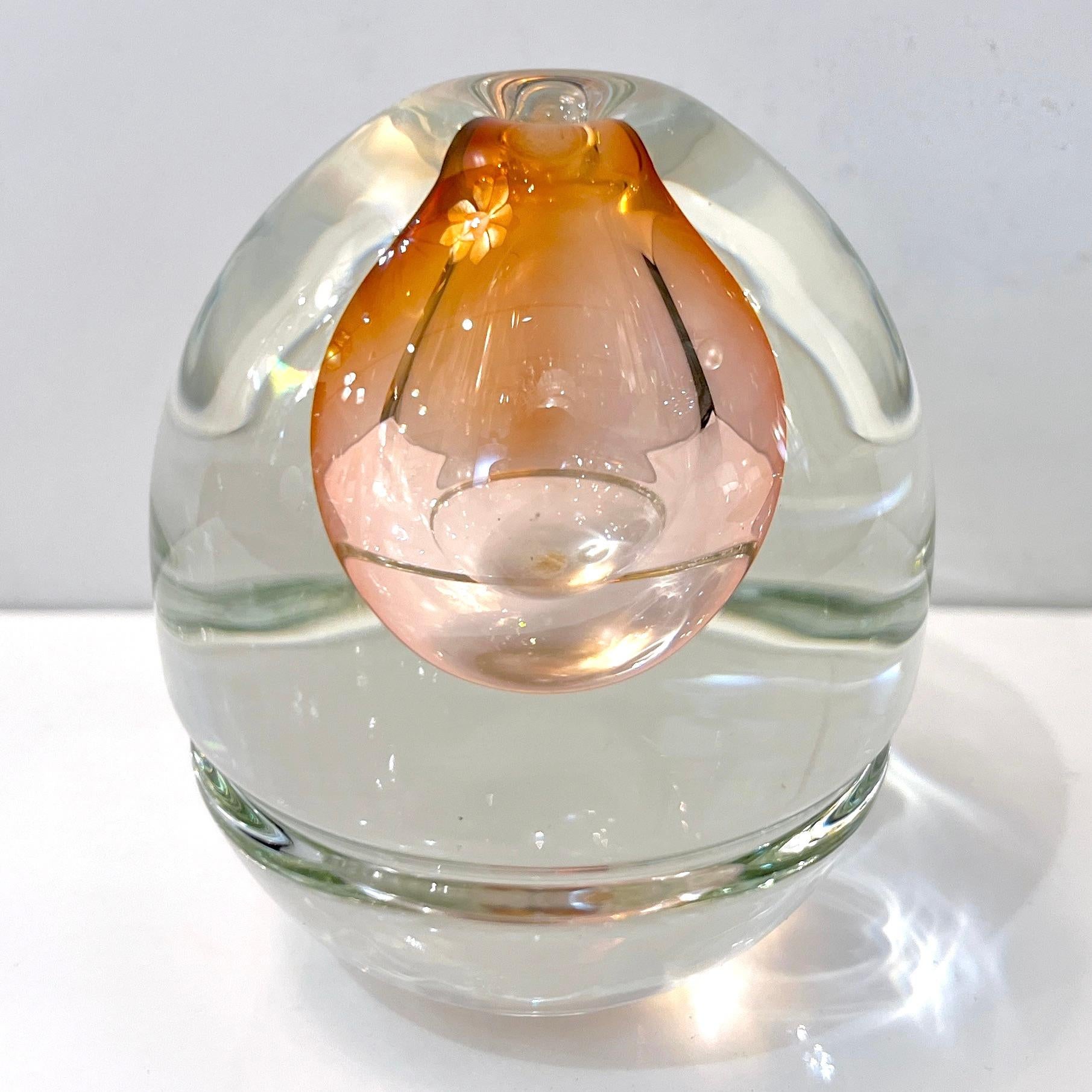 Signed Young & Constantin, numbered 048828, a sophisticated Art glass studio small vase with Art Deco flair in blown glass, with an empty drop shape core of rare color, a blush rose champagne pink, worked in sommerso, overlaid in crystal clear