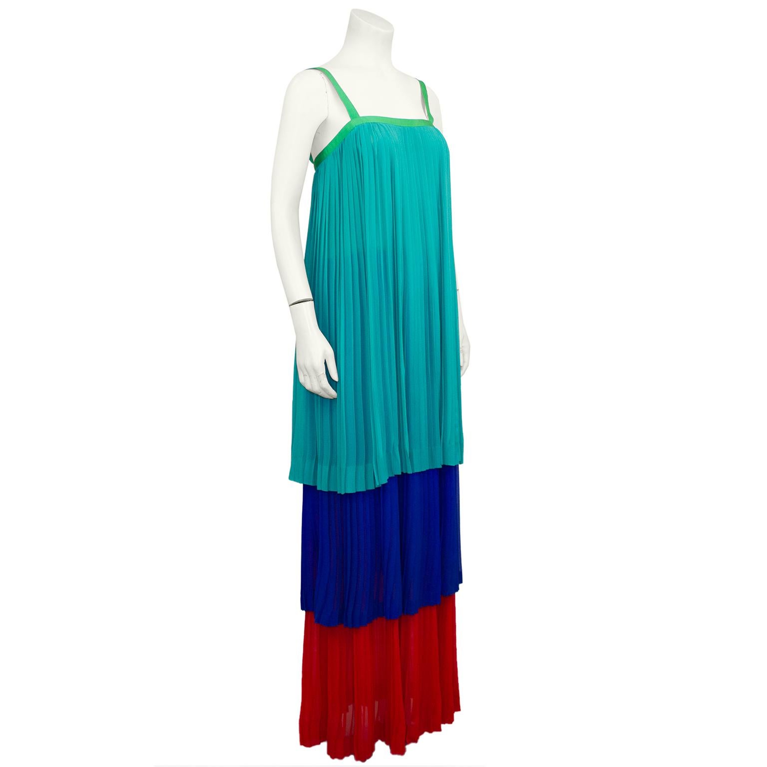 Yves Saint Laurent Rive Gauche label pleated chiffon gown from the “High Seas Chic” RTW Spring 1978 collection. The tricolour chiffon tiers are pleated with the first layer draping from the bust to the mid hip, second falling to the mid calf and the
