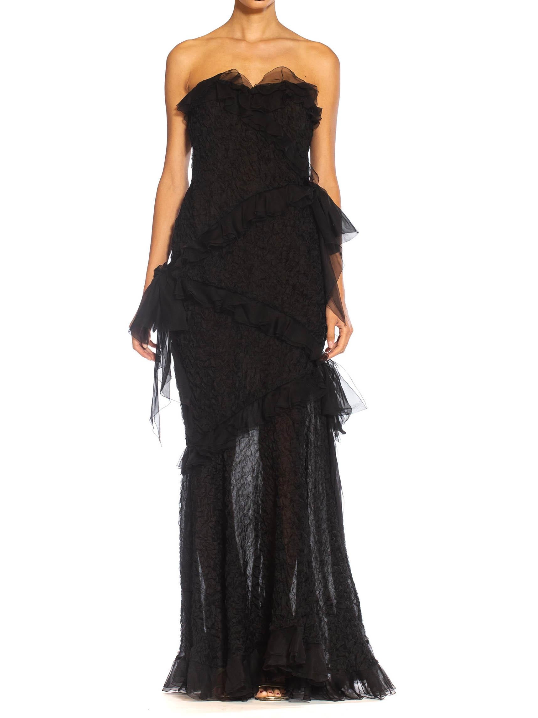 Beautifully lined in a sexy chocolate brown to add depth to the sheer black 1980S YVES SAINT LAURENT Black Silk Textured Organza Strapless Gown With Chiffon Ruffles 