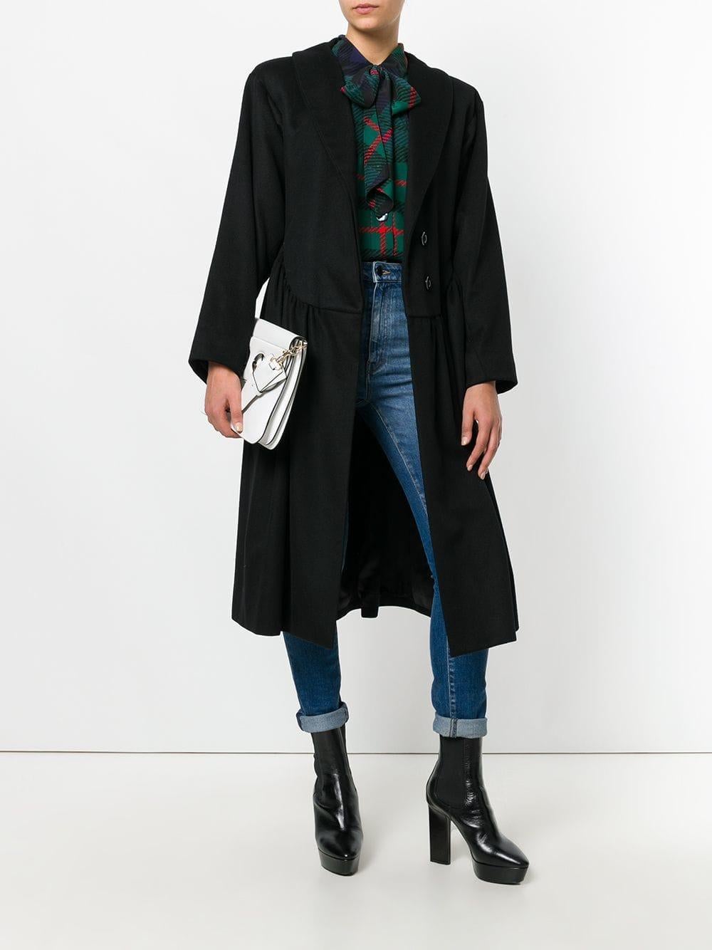 Yves Saint Laurent black wool oversize midi coat, featuring notched lapels collar, long sleeves, buttons front fastening, lightly gathered fabric along the waistline and two vertical front pockets. Lined in black satin and with padded