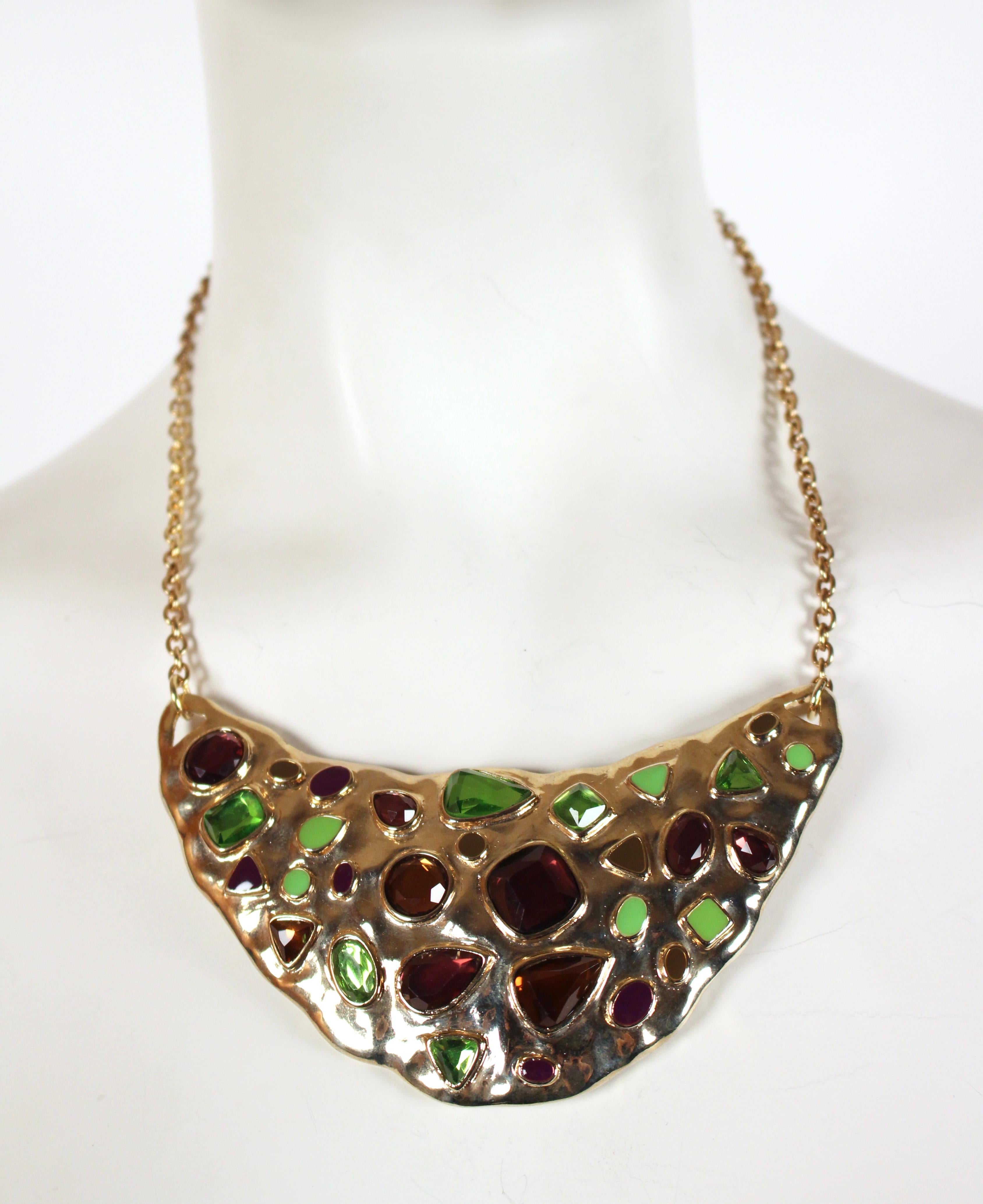 Striking, amethyst, peridot and topaz faceted glass crystal bib necklace with enamel accents designed by Yves Saint Laurent dating to the 1990's. Adjustable spring closure. Measures approximately 16-19