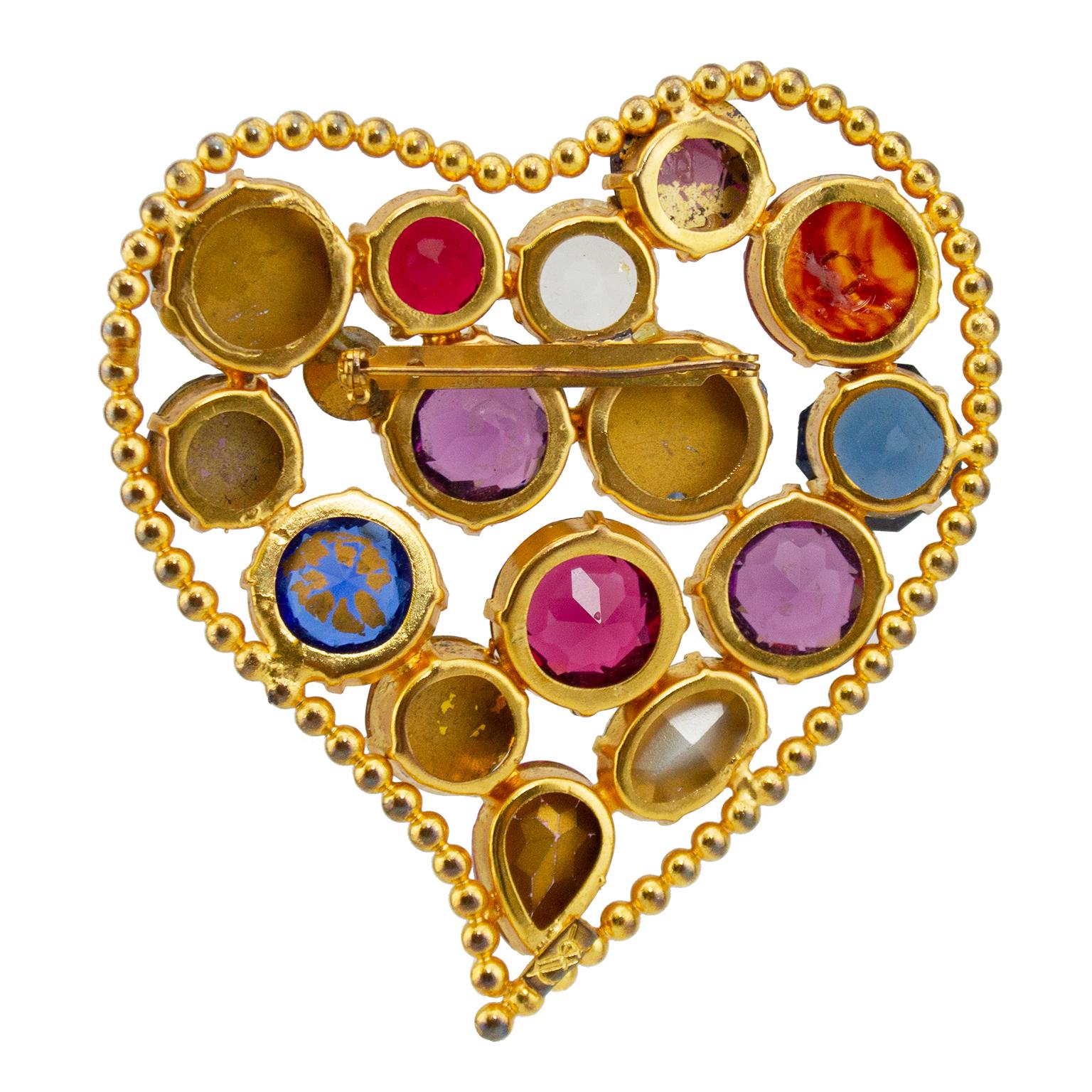Stunning, vibrant, oversized and powerful Yves Saint Laurent brooch from the 1980s. Heart shaped gilt metal with 16 different faceted glass stones in a range of colours and textures. YSL marking on back. Very good vintage condition. Some small signs